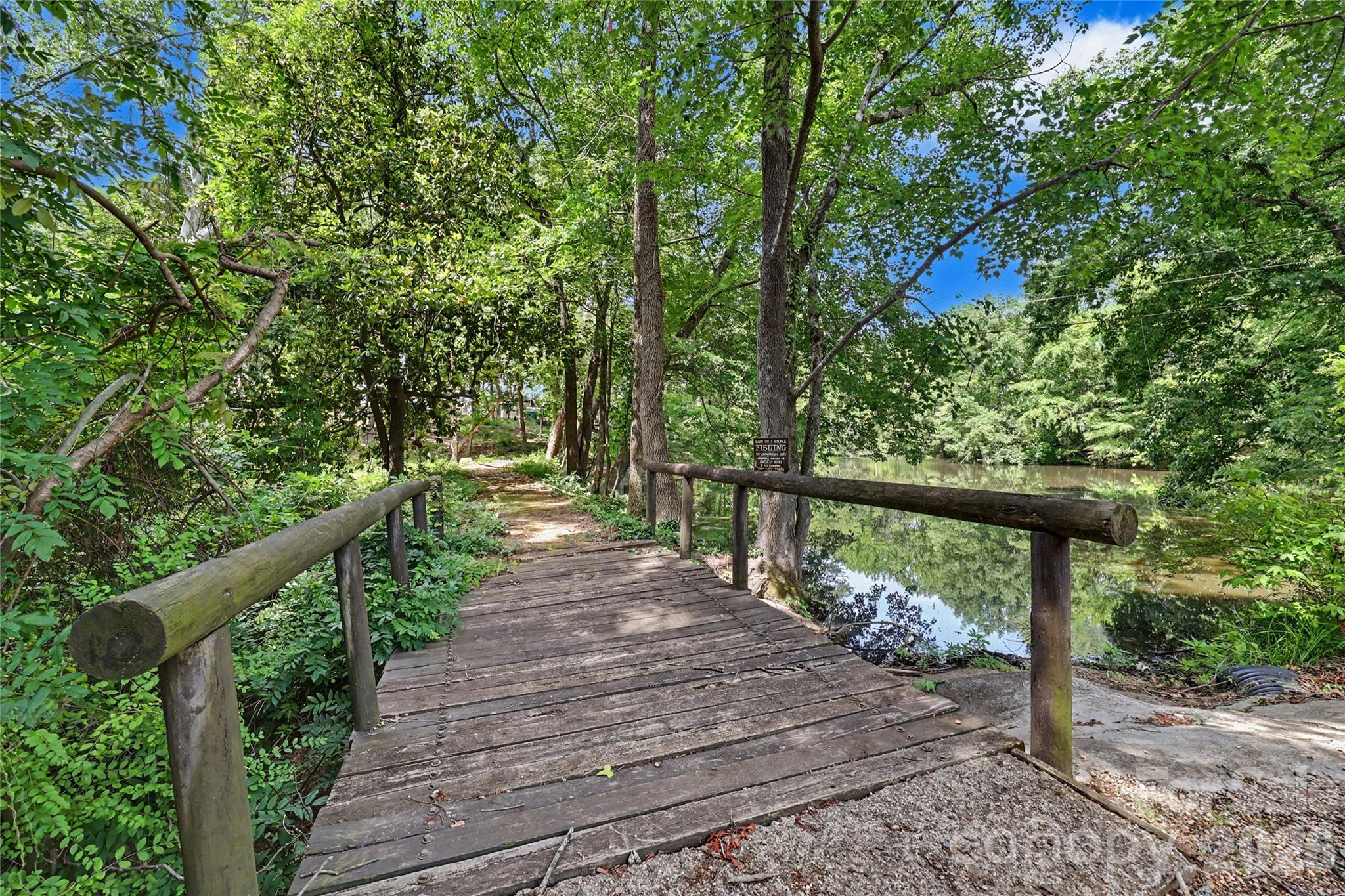 Unique opportunity to build your dream estate on a stunning 1.877-acre cleared waterfront lot in one of Charlotte’s most desirable locations. Nestled along a tranquil pond at 6510 Sharon Hills Road, this exceptional property offers a unique combination of privacy, natural beauty, and premier convenience. The previous home has already been removed, creating a true ready-to-build homesite surrounded by mature trees and peaceful water views. The property extends along the scenic walking trail atop the pond dam, adding to the charm and recreational appeal of this unique setting. Located just minutes from Southpark, Quail Hollow Club, fine dining, luxury shopping, and a short drive to Uptown Charlotte, this property provides the perfect backdrop for a custom luxury residence. Expansive acreage, serene pond frontage, and an unbeatable location make this one of the area’s most distinctive and desirable build opportunities.
The utilities (water, gas and electricity) were capped prior to the removal of the previous home.