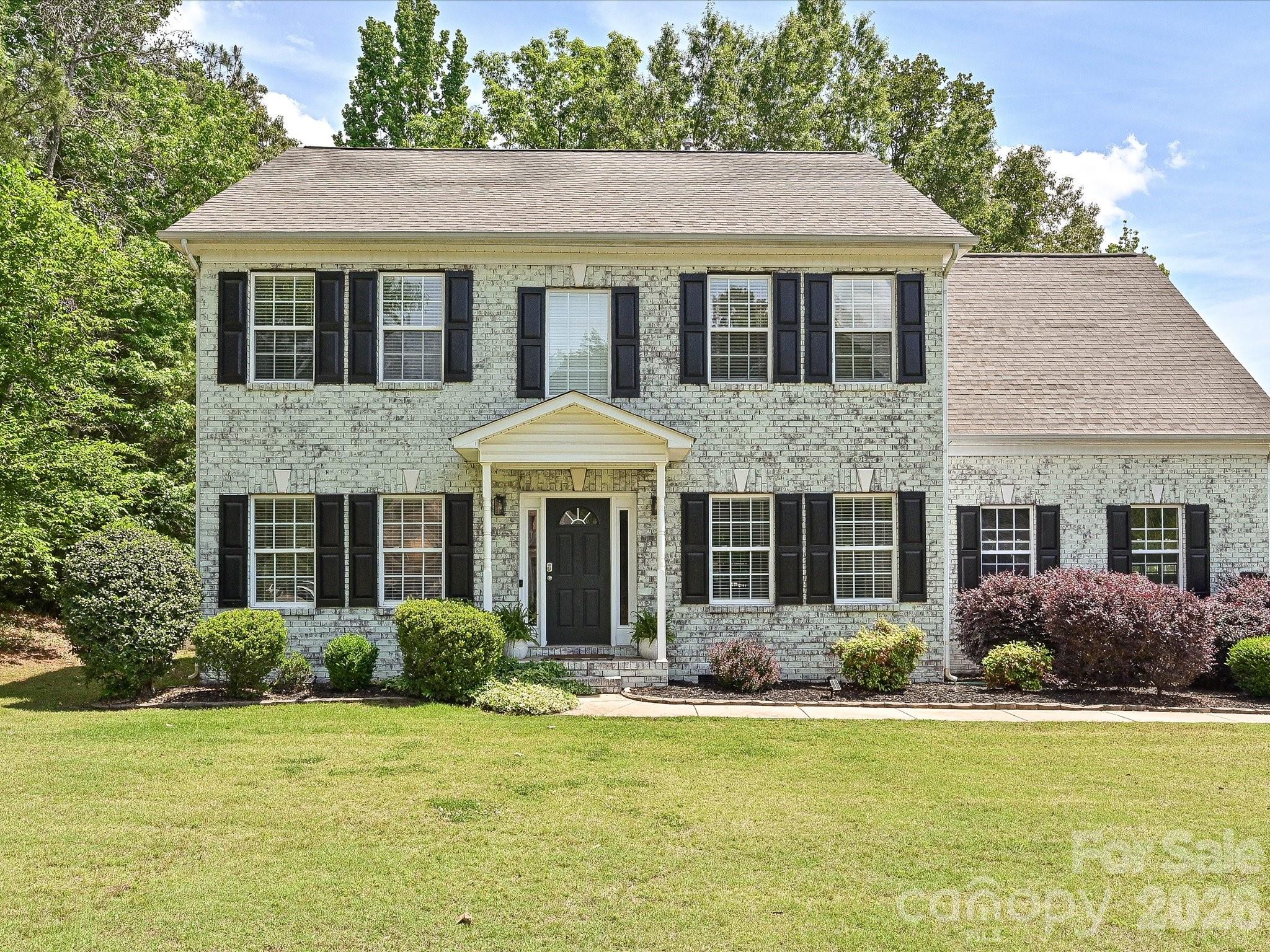 Beautiful two story home on large corner lot in sought after Shiloh Commons. The best of both worlds collide here where timeless traditional construction meets today's trends in an interior that boasts modern features and an open floorplan.  

Lovely front entrance as you step into rooms that can be whatever you need or want.  If you like a clean white color palate, this home is ready for you.  Accent columns and luxury vinyl plank floors add to the crisp clean look. To your left as you enter, a gracious living room or whatever you need; to the right a space perhaps designed as a formal dining room but for now an inviting playroom for the littles that could also be a beautiful office or library.  Continue to the comfortable sun splashed den with gas log fireplace.  Step through sliding glass doors to a great and huge deck.  Lovely white marble kitchen open to the den allowing the cook to always be part of festivities with family or friends.

Upstairs you will find four generous bedrooms including the beautiful primary suite.  Eye catching black and white en suite bath offers separate tub and shower, water closet, separate vanities. and large closet.  Laundry closet is perfectly located in upstairs hall to service both primary and second bath easily.

This home has had many improvements and upgrades in the last few years including a new roof (2024), A/C (2019), Water Heater (2022), Bermuda sod (2022).  The wonderful and HUGE deck was added in 2020 and backyard partial fencing in 2021.  Ikea "built in" shelf and storage system just installed in playroom.  2025 limewash gave the home an interesting and striking new look.

Shiloh Commons subdivision is conveniently located north of Lancaster providing easy commuting to Indian Land, Rock Hill or the Greater Charlotte Area.  This subdivision is definitely proving to be a desired location for many.

Make plans now to see this lovely home and all it has to offer!