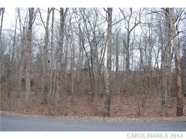 One of the last good building lots in established NW Cabarrus neighborhood, near Whispering Winds.  Sewer and water tap fees have been paid by seller.   Wooded setting, basement is possible but not required.  Private, walkable neighborhood close to elementary, middle and high school.    3/4 acre lot, build what you want!  Rare opportunity in a favorite Concord location.