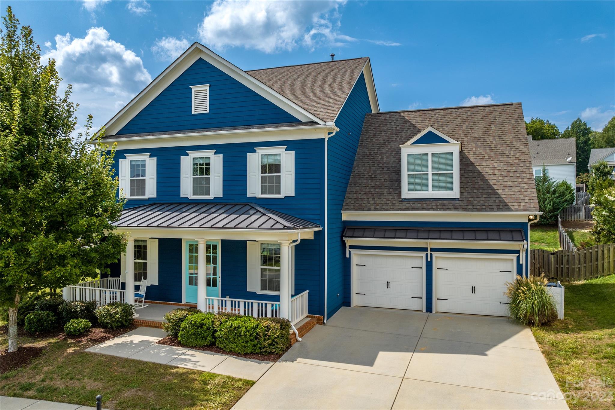 Welcome to this John Wieland built home with a charming front porch!  This open floorplan greets you with an abundance of natural light and a convenient layout.  The first-floor features hardwood floors, a guest bedroom with custom barn door, bathroom, dining area, large great room, drop zone off the garage, and an ideal kitchen. 
Open kitchen space with a breakfast nook, large island area, induction cooktop, as well as a separate butler pantry between the kitchen and dining area. 
Upstairs has a separate bonus room, additional loft area, 2 bedrooms, as well as the Primary Suite.
The Primary Suite has beautiful windows, tray ceiling, 2 vanities in the bathroom, large walk-in tiled shower with a garden tub, and 2 closets. 3rd floor walk-up attic offers great storage and the potential to add finished area and make this your own. Head out back to see the large fenced in yard with established privacy trees.
Home has a tankless hot water heater and water filtration system.