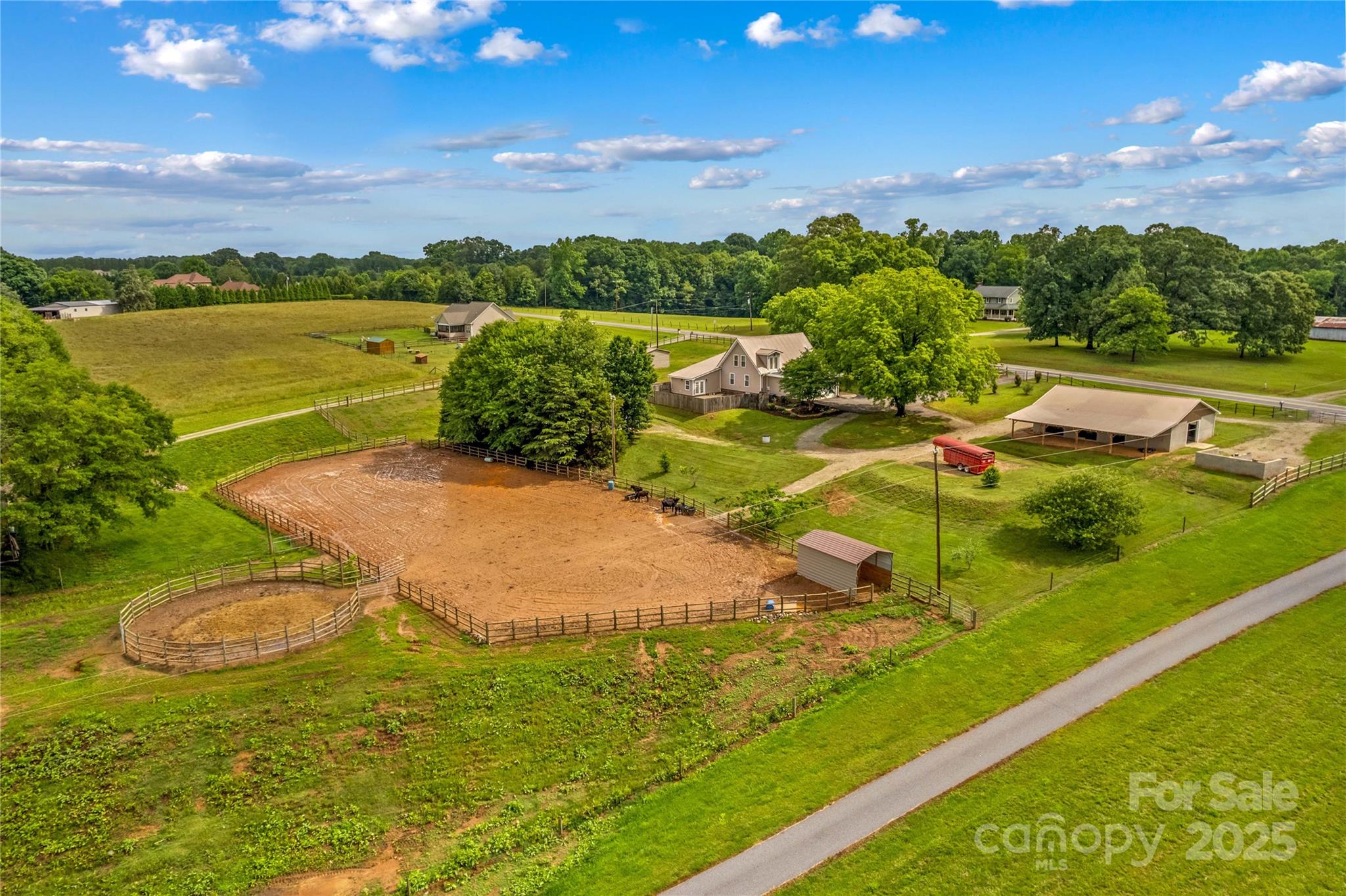 Desirable Location near Lake Norman State Park for Lake Access while living Country Life to the fullest! Bring your Horses or your Four Wheelers and Dirt Bikes to 4.9 Acres. Fully fenced property and Gated entrance at Driveway. 4 Bedroom Home with Bonus room. This is a Modern Farm Home that has Newer Updates throughout. Metal Roof & vaulted wood Beam ceilings. New wood floors on Main, and new Luxury Plank in all Bedrooms. Upstairs, Spacious Primary Bedroom with vaulted ceiling and Full Bath. Kitchen has newer Stainless Appliances that convey. A Huge Kitchen island & Granite counters complete the fresh design. Laundry Room and a Flex Room for Hobby use. Enjoy Summer fun outside by the in-ground Pool. Huge concrete Deck for Bar B Que grilling and entertaining. The Horse amenities include a New 40 x 50 Barn in 2018, with Six Stalls, a Wash stall and Tack storage. Wide center isle with Horse Mat Padding. Shed Cover area for additional hay storage. 110x250 Lighted Riding Arena w/ sand footing & 50' Round Pen, Fenced Pasture & Pasture Run in Sheds. 30 x 30 Workshop Garage with 220 AMP Electricity!