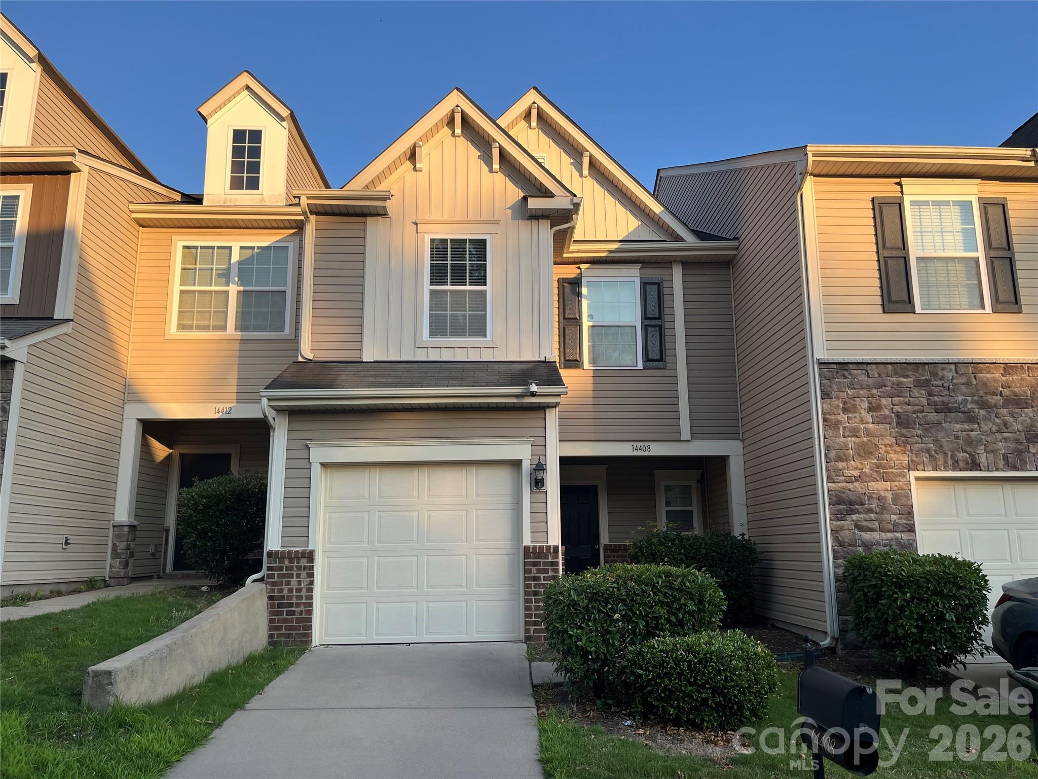 Location, Location, Location! Welcome home to this 3-bedroom, 2.5-bathroom townhome perfectly situated just 10 minutes away from UNC Charlotte, shopping, dining, and entertainment. Step inside to an airy open floor plan designed for modern living. The kitchen is the heart of the home, boasting a center island, granite countertops, a tile backsplash, stainless steel appliances, breakfast bar, and a convenient built-in desk—all seamlessly overlooking the dining and living areas. Glass doors lead out to your private back patio, allowing beautiful natural light to flood the entire main level. Upstairs, you will find a versatile loft space that is perfect for a home office, media room, or play area. The primary suite serves as a peaceful retreat, featuring a private ensuite bath complete with a dual vanity, a soaking tub, and a separate shower. Two additional bedrooms round out the upper level, sharing a full hall bathroom. Enjoy low-maintenance living at its finest, as the HOA covers your water and sewer services as well as full lawn care. Residents also get to enjoy fantastic community amenities right outside their door, including a swimming pool, pond, sidewalks for evening strolls, and a playground. Don't miss out on this perfect blend of convenience, style, and community—schedule your showing today!