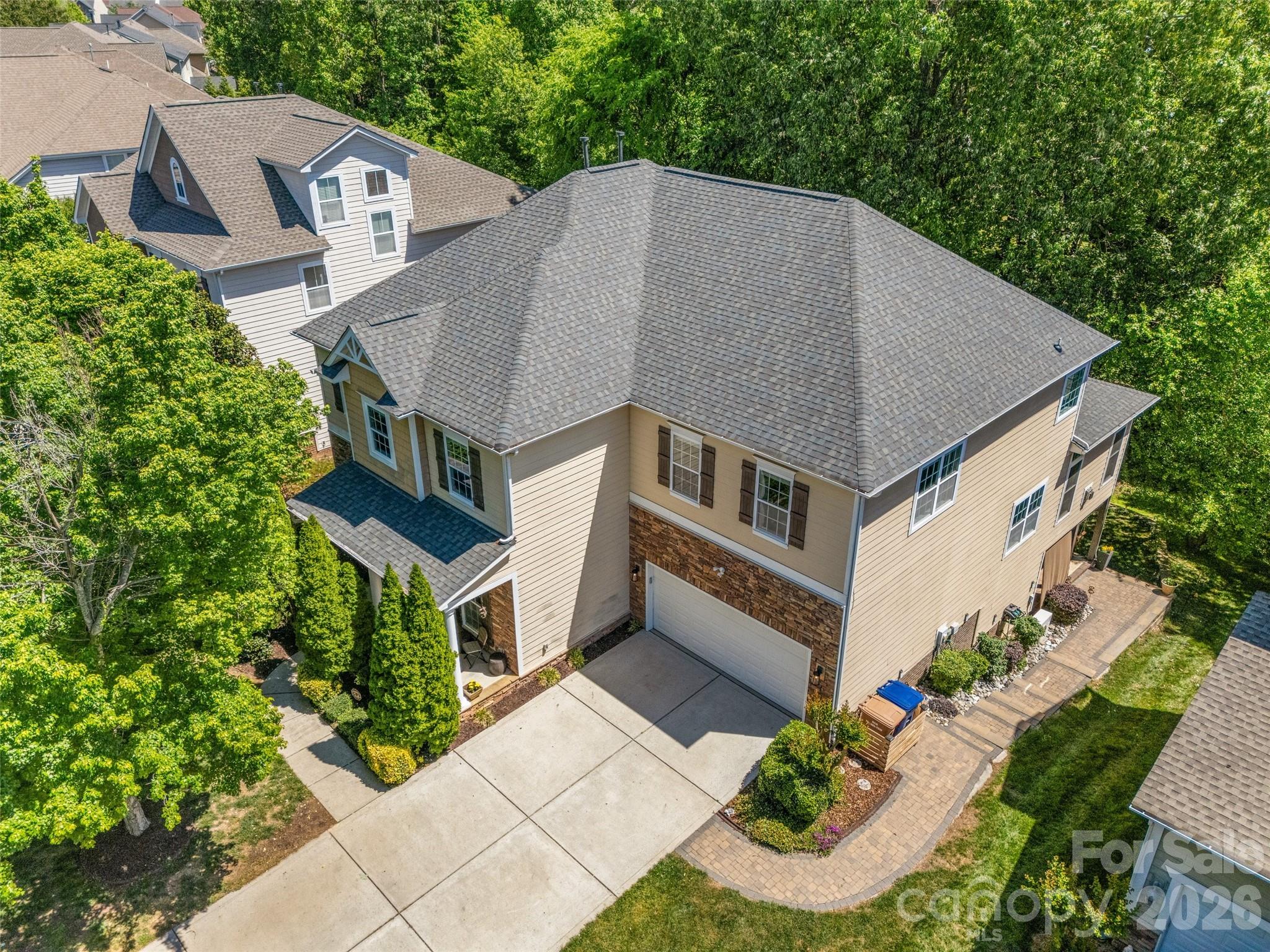 LAWSON, in WAXHAW! 5 bedroom including a guest Bedroom & full bath on Main. Treehouse in the backyard & gorgeous covered patio for entertaining! Main floor features: 10' ceilings, Sunroom with fireplace, Great Room with fireplace,  Kitchen with island, Dining Area, Office with French doors & Dining/Living Room. Kitchen has granite countertops, stainless appliances, Gas cooktop 2026, French door style refrigerator 2023, dual wall ovens, & walk in pantry. Upstairs NEW carpet installed April 2026, 4 bedrooms including the Primary Bedroom with a separate sitting area, dual closets, separate vanities, garden tub, walk in shower & water closet.  All of the bedrooms have great closet space! The laundry room & very large bonus room are also upstairs.  Roof 2025, hot water tank 2024, one of the hvac units is 2023. Home also comes with a Choice Home Warranty through June 2027. Lawson is a master planned community known for its amenities! Tree lined streets, walking trails, pools, water slide, The Mill house clubhouse, pickleball courts, tennis courts & playgrounds. Home attends Union County School district. Located just under 10 minutes to downtown Waxhaw, NC.