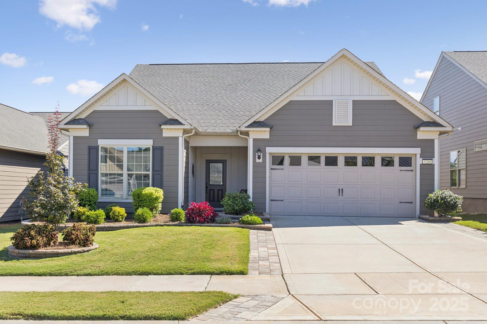 Lots of Upgrades and Move-In Ready! 
Step inside this meticulous 3BR/3BA home located on a cul-de-sac. All flooring downstairs has been replaced. Interior walls have been repainted - no more builder-grade paint. A versatile Flex Room with custom office-style built-ins provides an ideal space for work or hobbies. The open Kitchen, Eating Area, and Living space provide ease and functionality. All appliances have been upgraded - stove, microwave, Bosche DW - the Refrigerator remains. Sunroom overlooks the common area in the back. The screened porch has cafe lights and an upgraded epoxy floor, and an extended patio where you can relax and enjoy peaceful views with no one behind you.  The owner's spacious ensuite bedroom has a tray ceiling, and a wall of windows overlooking the back -tiled shower, a granite vanity, and a large walk-in closet complete the bath area.

Upstairs is an open Loft, Bedroom, and Full bathroom, which are accessible through the French door in the main level foyer. Additionally, the large storage area is being used as a small kitchen. 
Upgraded landscaping with stone edging, gutters, a separate water meter for the irrigation, and, of course, the resort style amenities offered - indoor/outdoor pools, tennis and pickleball courts, bocce ball, corn hole, fitness classes, workout room, shuffleboard, meeting rooms, various social clubs and activities, and more.