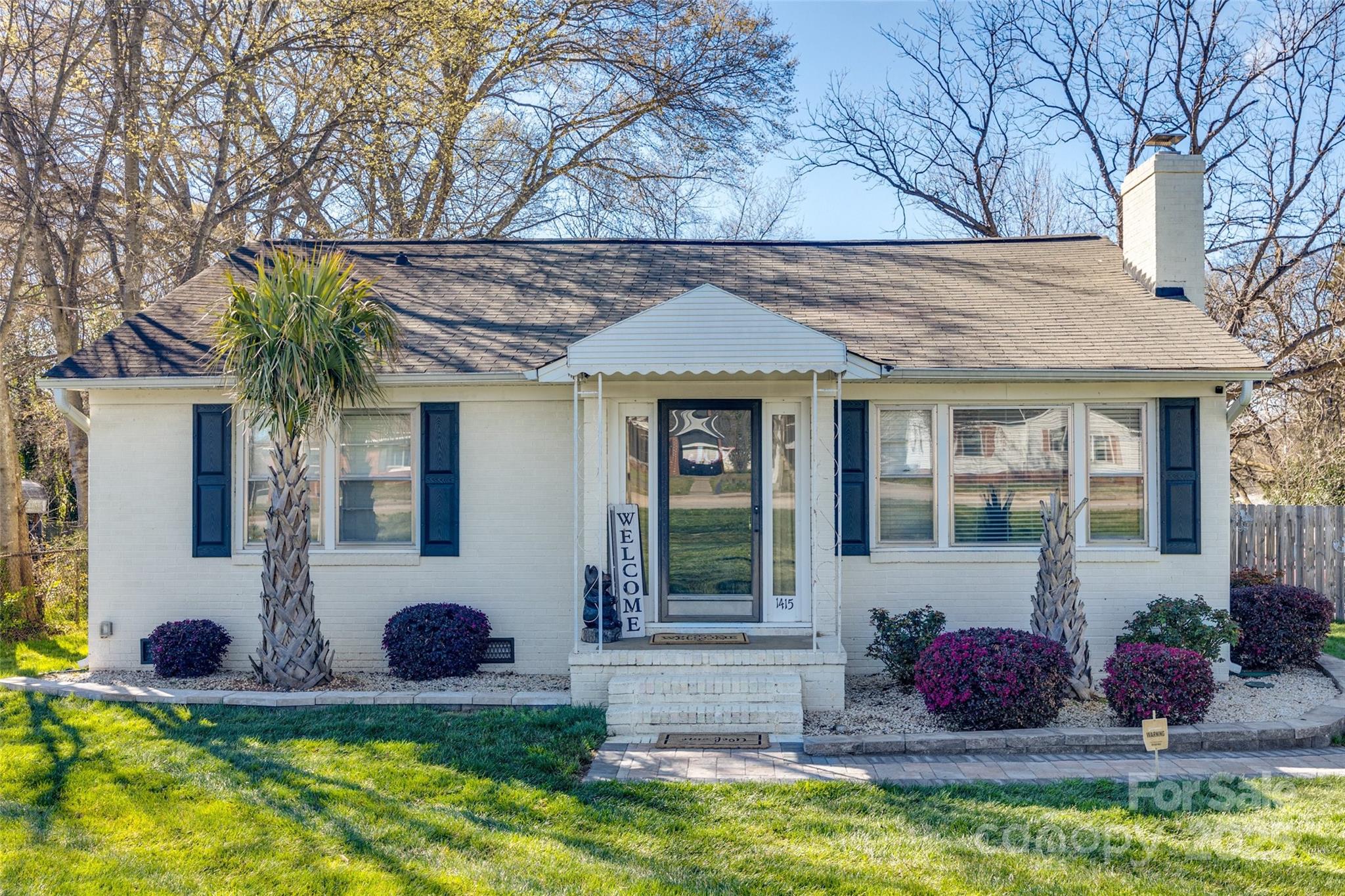 Well-maintained brick ranch blends charm with modern updates. Featuring bamboo flooring and recessed lighting, the inviting living room offers a cozy gas-log fireplace. The kitchen boasts stainless steel appliances, a pantry, and a seamless flow into the breakfast nook. The spacious primary suite includes an en suite with a tiled walk-in shower and double vanity.

Step outside to an entertainer’s dream! The backyard features a 16x20 metal-roofed carport, 12x16 workshop with electricity and window unit, and a fenced pet area. Enjoy an above-ground pool, wood-burning oven, built-in grills, and two patios—30x12 with an outdoor cooking area and 16x14 with a fire pit. Additional perks include an irrigation system, lush sod (front & back), and outdoor speakers.

Located on a spacious lot with easy access to I-77, shopping, and dining, this move-in-ready home is a must-see! Schedule your showing today!