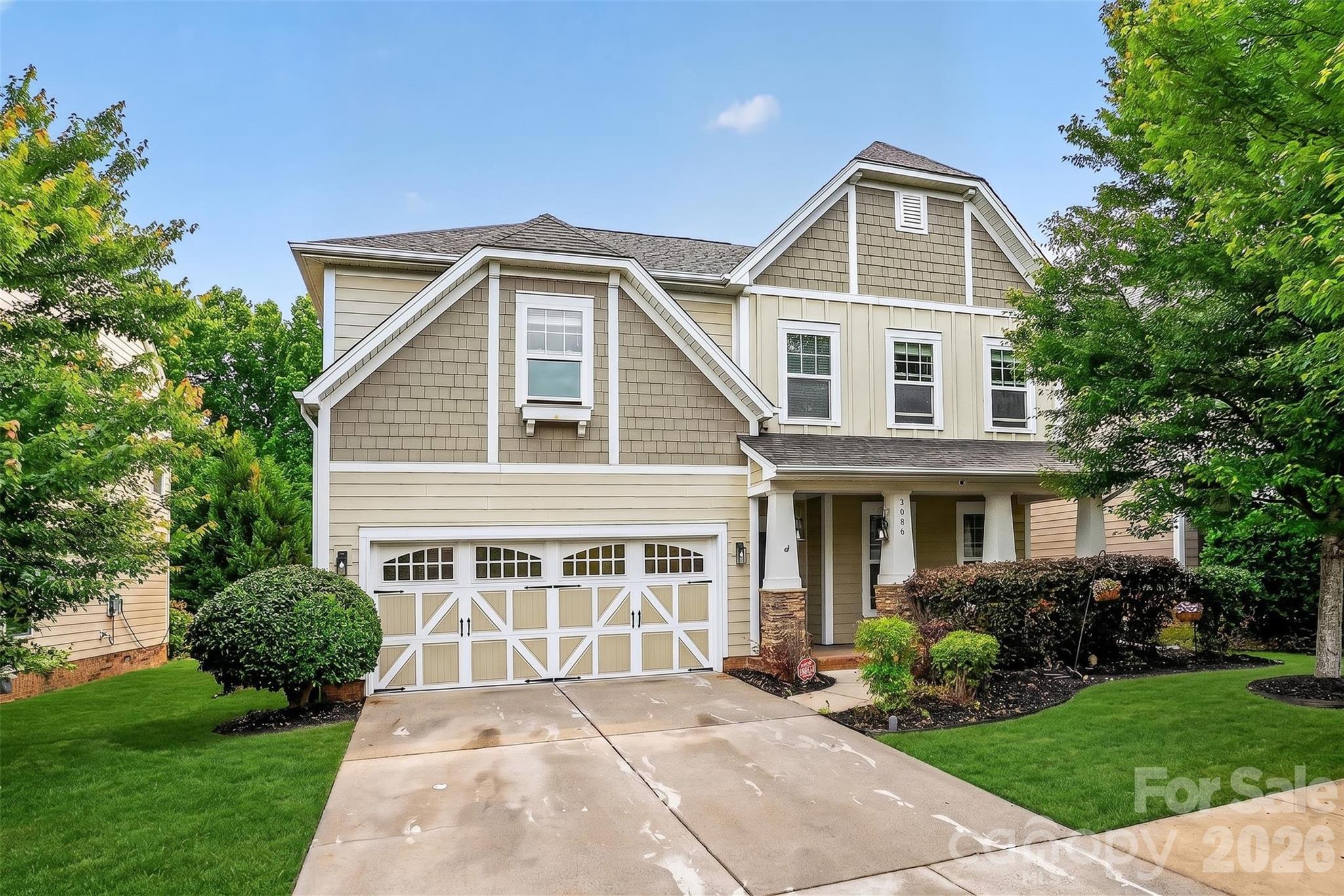 Welcome to Millbridge in Waxhaw, located within the Kensington Elementary and Cuthbertson school districts. Situated on a private wooded lot, this 5-bedroom, 2.5-bath home offers an open floor plan with hardwood floors and detailed woodwork throughout the main level. The gourmet kitchen features a large island, stainless steel appliances, stacked 42” white-painted cabinets, a walk-through pantry, and views of the wooded backyard. The dining area opens seamlessly to the kitchen and living spaces, creating a functional layout for everyday living and entertaining. The spacious great room includes large windows for natural light and a corner fireplace. A rear staircase provides convenient access to the second floor. Upstairs, the primary suite includes a large walk-in closet and ensuite bath. Three additional bedrooms share a dual-sink bathroom, and the laundry room is conveniently located upstairs. The fifth bedroom offers flexibility for a home office, guest room, or bonus space.

Outdoor features include an extended concrete patio with café lighting overlooking a wooded backyard. Additional updates include upgraded carpet, fresh interior paint, designer light fixtures, and a two-car garage.

Millbridge amenities include a clubhouse, fitness center, walking trails, and community pool..This is Millbridge living at its best. Come see why homes here don't last!