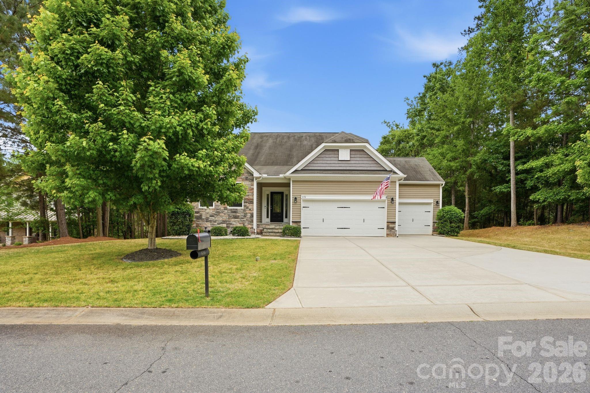 WATERFRONT - Experience peaceful lake living in this beautifully maintained waterfront home on a premium lot with Lake Wylie water frontage, perfect for kayaking, canoeing, and soaking in the views. This open-concept 1.5 story ranch offers spacious living with a large family room, oversized kitchen with island and breakfast bar, luxurious primary suite with tray ceiling, and an upper-level loft with additional bedroom and full bath. Enjoy evenings on the screened porch or entertain on the expansive stone patio featuring pergola lighting and a fire pit. Additional highlights include a 3-car garage, extended driveway, irrigation system pulling from the lake, abundant storage, and community boat storage and community pool. Loaded with upgrades and move-in ready!