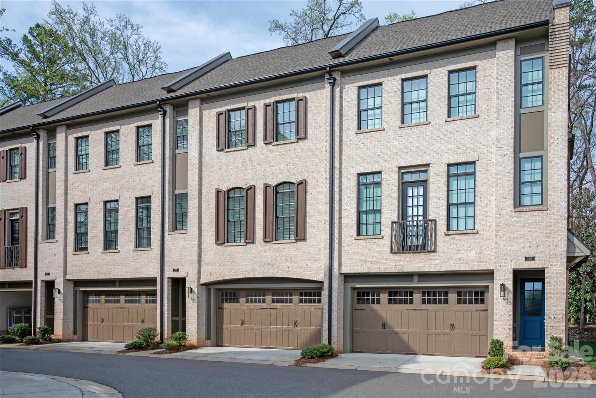 This stunning 3 story townhome offers exceptional living in the highly coveted Myers Park neighborhood. This preferred location inside the complex, the building backs to a heavily treed, serene space. Upon entering, the impressive ceilings, lighting and hardwoods throughout set the tone for something special. The main level has a beautiful white Kitchen with island, quartz countertops, stainless appliances and walk-in pantry. Coffered ceiling, gas fireplace and built ins featured in the expansive Living Room. The Dining Room opens to the Kitchen and Screened Porch. Two Primary Suites on upper level. Upstairs Laundry Room and separate linen/utility closet. Lower lever Bedroom currently used as an office. Murphy Bed wall by California Closets wall stays, giving this room many options. Tons of storage space on all levels. A main level closet is currently a 2nd office; would be great 2nd pantry. The private upper screened porch and covered patio beneath both feel far from the city, when in fact this townhome is close to Dilworth, Sedgefield and easy access to uptown and the airport. A perfect combination of style, functionality and excellent craftsmanship, this home provides everything you want. Refrigerator, Washer, Dryer & 3 TV's convey. **Seller can leave all furnishings. Ask listing agent for details.