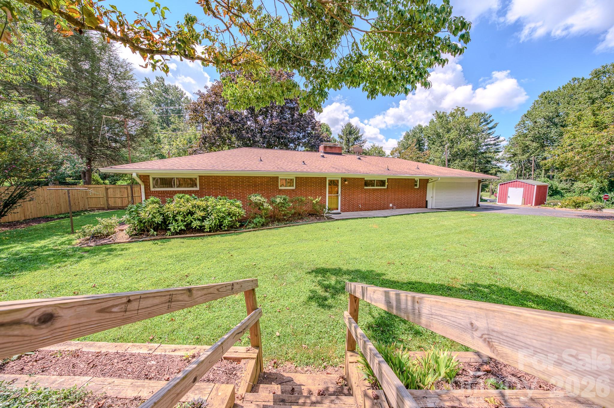 Rare opportunity to own a 4-bedroom, 2.5-bath mid-cent gem on Alexander Avenue in Grovemont-on-Swannanoa — part of one of America's first planned communities, developed by E.W. Grove beginning in 1924. This architectural treasure sits on a desirable corner lot and strikes the perfect balance between authentic mid-cent character and modern updates, featuring a refreshed kitchen and baths while preserving the original design integrity that makes these homes so sought after.
Practical updates are already done — roof replaced in 2018, a brand new privacy fence, and an extensively updated electrical system — making this one truly move-in ready. And with the seller offering $5,000 toward closing costs, stepping into this piece of history is more attainable than ever.
The historic Grovemont neighborhood offers a walkable lifestyle with the beloved Grovemont farmers market, library, and live music all within easy reach. And the neighborhood is only getting better. Beacon Park — a transformative new development on the site of the former Beacon Blanket Factory — is set to open just minutes away in 2026, bringing a world-class bike park, bouldering walls, a one-mile walking loop, playground, and a 4,000-person event lawn to Swannanoa. New local businesses including Short Sleeve Coffee and Ovenbird Kitchen are already open, with more on the way. This area is experiencing a genuine renaissance.
When you're ready to venture further, Biltmore Estate, the Blue Ridge Parkway, Black Mountain, and downtown Asheville are all just minutes away.
A coveted corner lot, a storied address, and a piece of American architectural history — all in one.