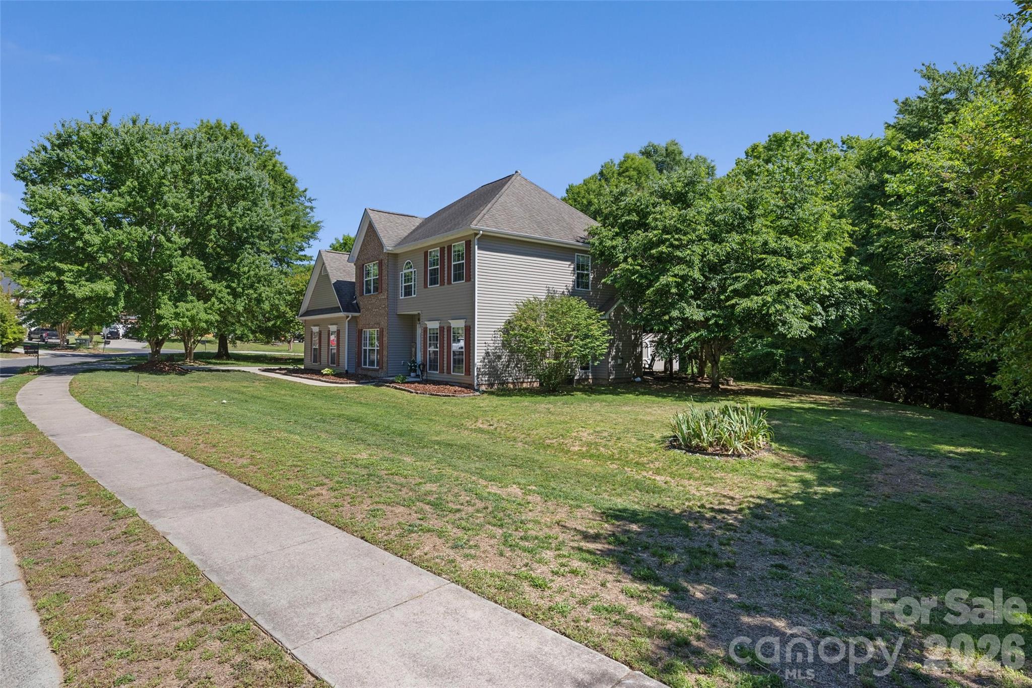 Welcome home to this warm and inviting 5-bedroom, 3-bathroom home offering comfortable living space on a peaceful dead-end street. Nestled on a .3-acre wooded lot, the backyard provides a private retreat complete with a spacious patio, 2 sheds, fire pit and pergola — perfect for relaxing evenings or entertaining guests.  

The thoughtfully designed floor plan features a bedroom and full bath on the main level, along with a formal dining room and versatile flex space to custom fit your needs. Upstairs, you’ll find four additional bedrooms including a spacious primary suite with a beautifully newly remodeled bathroom.  

Additional highlights include a side-load garage, oversized driveway, living room fire place, new fixtures and cozy charm throughout. Residents can enjoy a strong sense of community in a well established neighborhood. Enjoy exceptional neighborhood amenities including a pool with kitchen and party area, competitive HOA fees, playgrounds, basketball and picnic area as well as sidewalks throughout the community. Bethelfields also offers RV or Boat parking in a private locked lot for an extra annual fee. 

With access to award winning Clover schools and resident access to York County parks, this home offers the perfect blend of comfort, convenience, and community living.