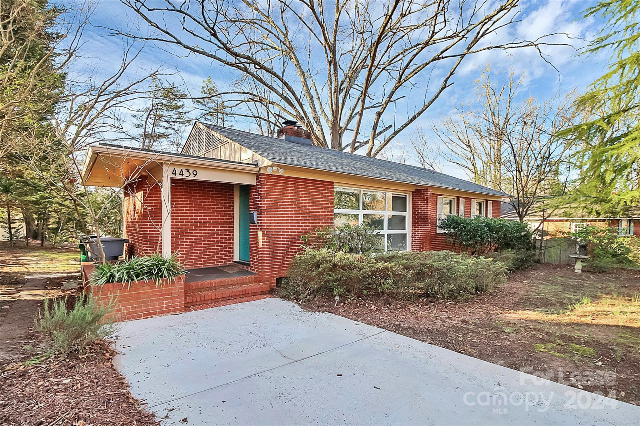 Come see this charming 3 bed/2 bath home nestled in the desirable Collins Park neighborhood! Step inside + be greeted by an abundance of natural light streaming through the expansive front windows, creating a warm + inviting atmosphere. The spacious living room boasts a cozy wood-burning fireplace, ideal for relaxing evenings with loved ones. Admire the timeless beauty of the original hardwood floors that flow seamlessly throughout the home, adding character + charm to every room. The kitchen features SS appliances, elegant butcher block countertops + ample storage space. Out back, you'll enjoy summer bbq's + quiet evenings under the stars in the massive backyard oasis. Your 3 bedrooms are tucked away on the right side of the home. The primary retreat also features an en-suite bathroom for privacy, while the two secondary bedrooms share another full bath. This home is conveniently located just minutes from the light rail, I-77, South End + Park Road Shopping Center!