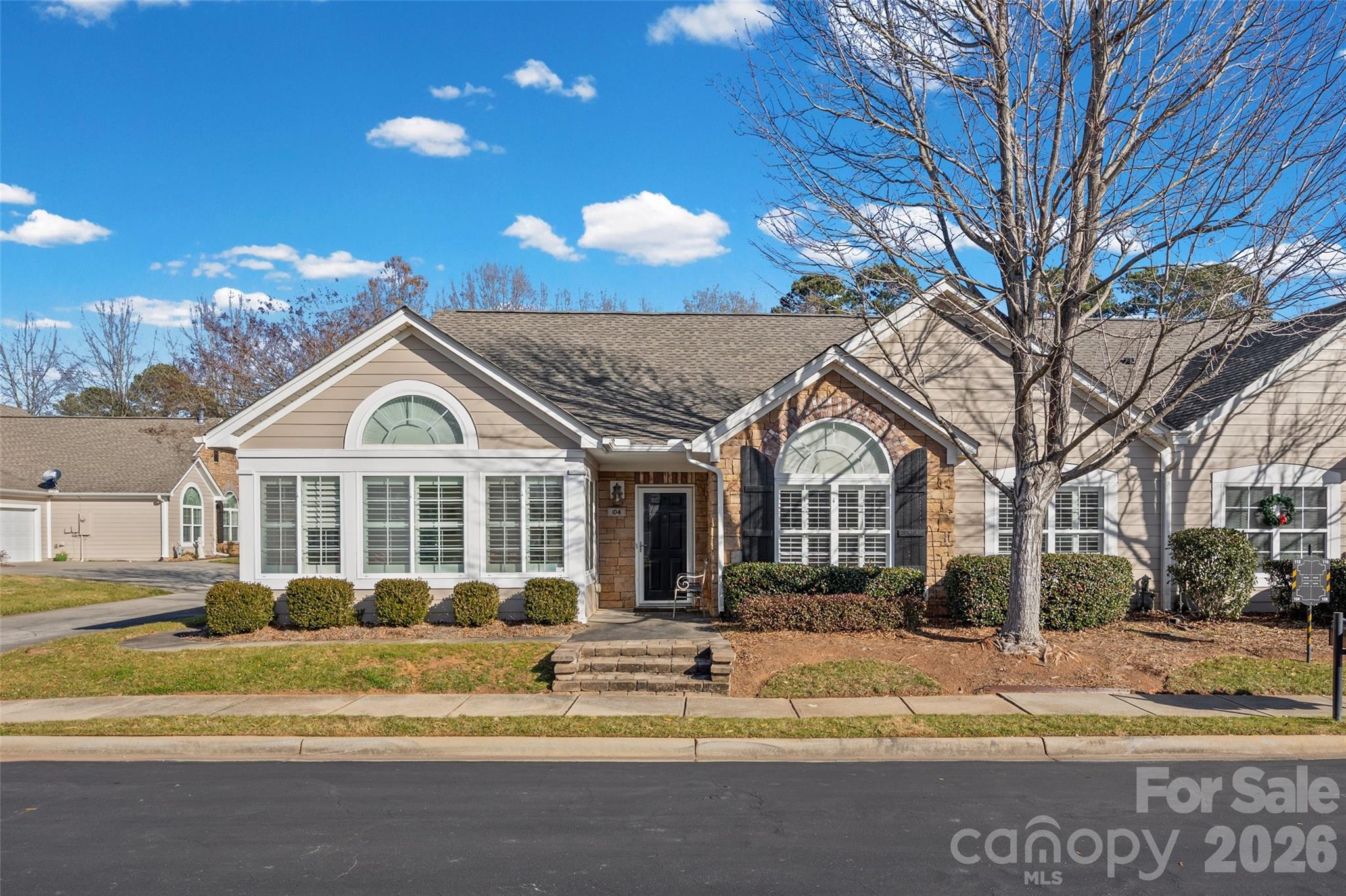 Hard-to-find one-level condo in an established 55+ community, offering handicap-accessible living with space, comfort, and character. This home features a spacious layout with a large family room, cathedral ceilings, and hardwood flooring throughout the main living areas. The front sitting room is filled with natural light and enhanced by brand-new plantation shutters, creating a welcoming space to relax or entertain. A double garage provides excellent storage, while extra parking makes it easy for guests to visit. Enjoy true convenience with this home located just a hop, skip, and jump from doctors’ offices, the hospital, and a variety of restaurants. The community offers outstanding amenities, including a clubhouse, fitness center, and outdoor pool, perfect for staying active and connected. In excellent condition and move-in ready, this home has been thoughtfully maintained and is priced right for today’s market. Comfortable, accessible, and full of charm—this is easy living at its best.