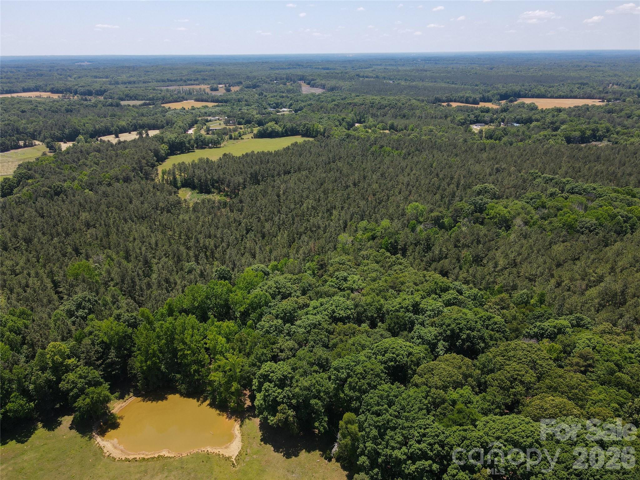 Beautiful nearly 71-acre tract featuring mature timber and a peaceful natural setting. This versatile property offers the perfect opportunity to create a private estate, family compound, or future residential subdivision. With ample space, scenic wooded areas, and development potential, this land combines privacy, investment value, and endless possibilities.