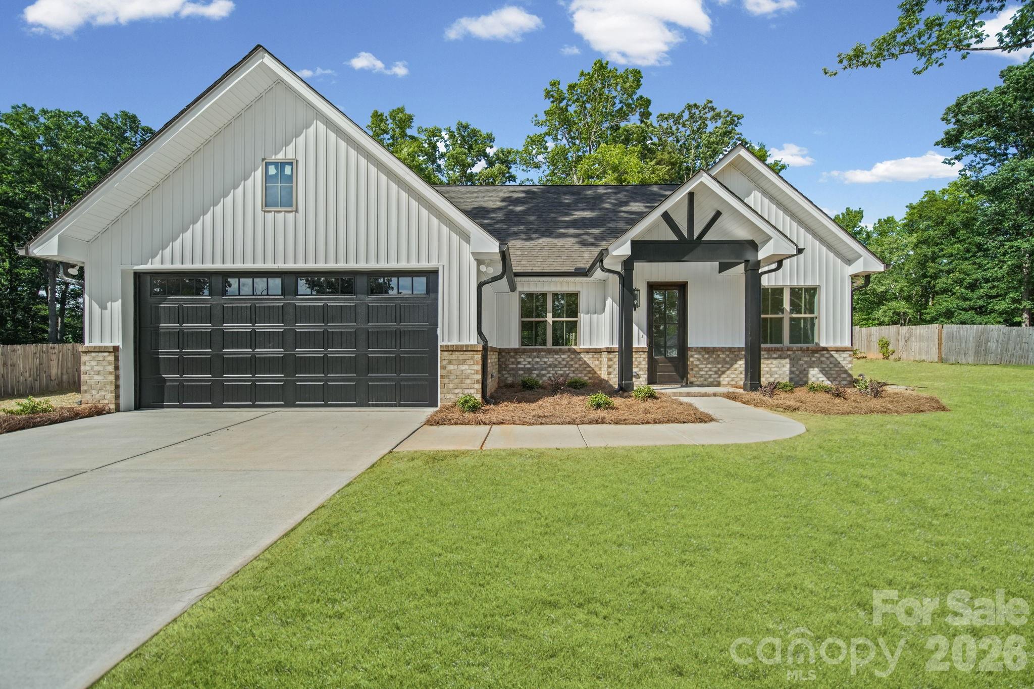 Welcome home to this beautiful new construction home situated on a spacious 0.50-acre lot in an established neighborhood with no HOA. Offering more than 1,700 square feet, this thoughtfully designed split-bedroom floor plan features 4 bedrooms, 2 full bathrooms, and a 2-car garage.

Step inside to find luxury vinyl plank flooring throughout the home, creating a seamless and low-maintenance living space. The kitchen and living areas are designed for both everyday living and entertaining, complemented by high-end finishes and attention to detail throughout. The primary suite offers privacy from the secondary bedrooms and features a well-appointed bathroom with tile flooring. Tile floors are also featured in the secondary bathroom for added durability and style.

Storage is abundant with custom-built shelving in the pantry and closets, maximizing organization and functionality. Enjoy the benefits of new construction while being nestled in an established community setting with room to spread out and no HOA restrictions.