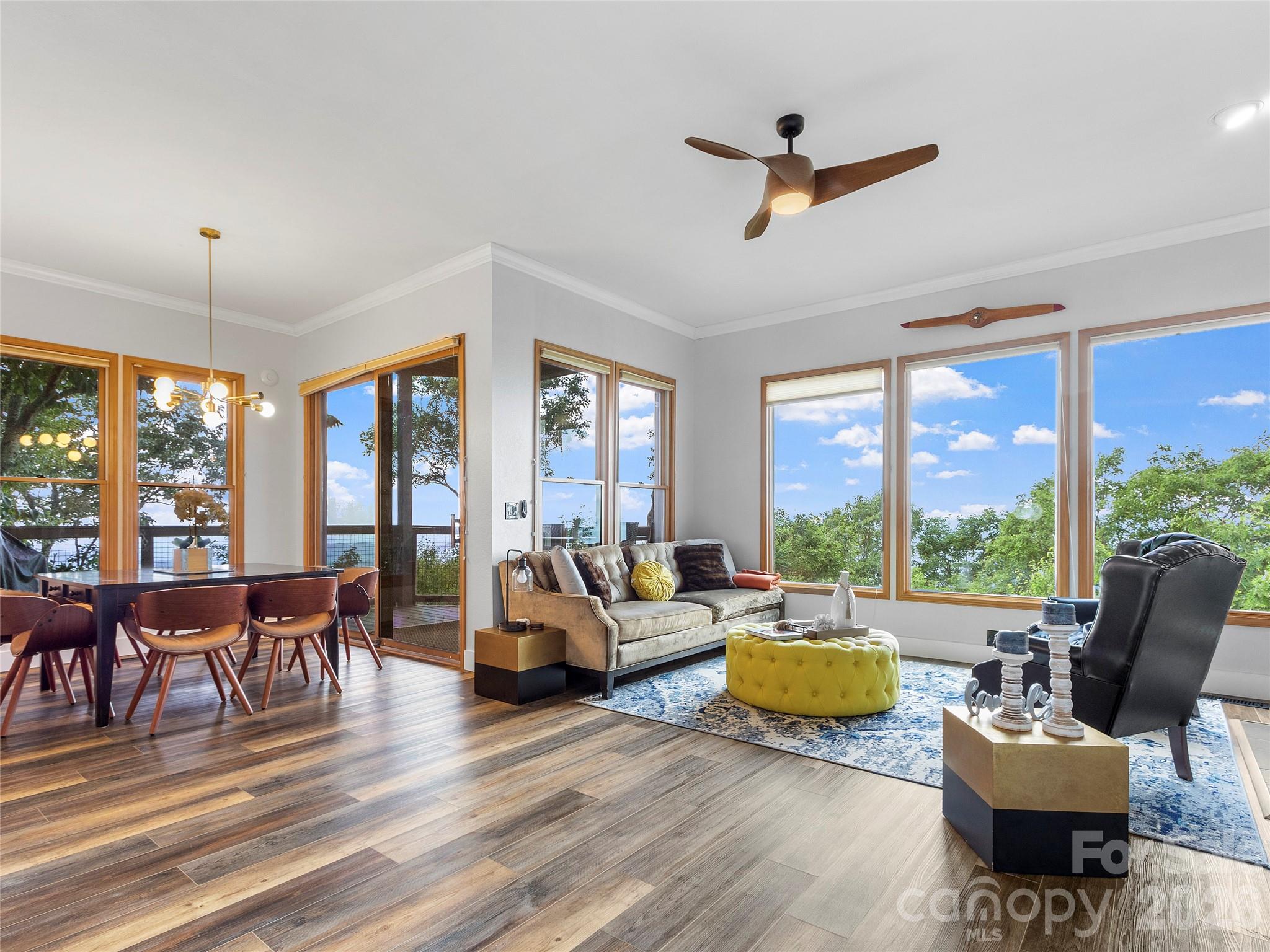 This club villa has a western and northern long range mountain view! You are on the corner so you can see both directions from this deck. The sellers did a great job remodeling this unit and even added a half bath for your guests to use. They also moved the washer dryer so you can have a larger pantry space in the kitchen. Floors, cabinets, bathrooms are all new. You wouldn't recognize it from the previous pictures. Luxury Tub in the master bathroom, new walk in closet, new kitchen, ready to move into. Fully furnished! Mountain Air is a gated community on the west side of Yancey County, just 35 minutes from Asheville. All owners have access to 6 parks and 7 miles of hiking trails. Mountain Air Country Club is a private club at the top of the mountain with its own airstrip, golf, tennis, pickle ball courts, nature center, kids' day camp, golf shop, golf learning center and 3 dining choices, including the mountain market. The average daily temperature is 75° in the summer.