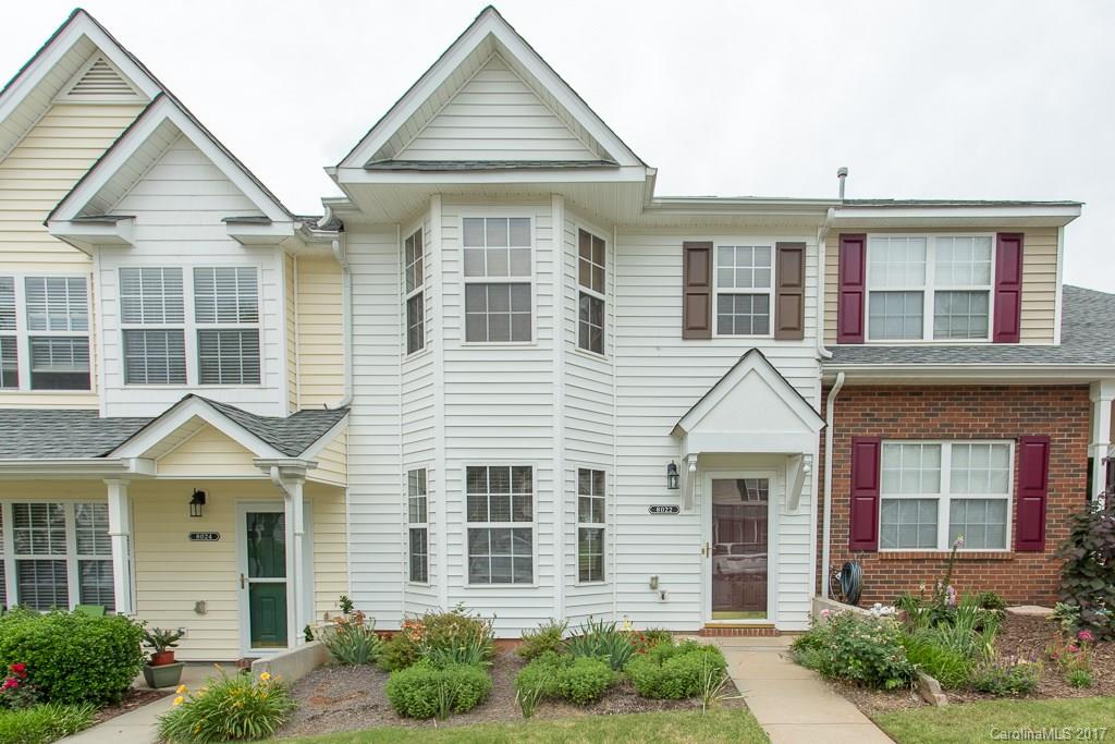 Lovely 2 bedroom/dual-master townhouse in highly sought after Hanover in Indian Land. Upgraded w/ wood flooring upstairs & downstairs, stainless steel appliances, ceramic tile in the kitchen & laundry, new carpet on the stairs & a freshly painted downstairs! Bedrooms have ceiling fans, bath & walk-in closets.  Located one mile from local schools, minutes to Ballantyne, highways, shopping etc. Amenities include neighborhood pool, lawn-care & maintenance & a playground!