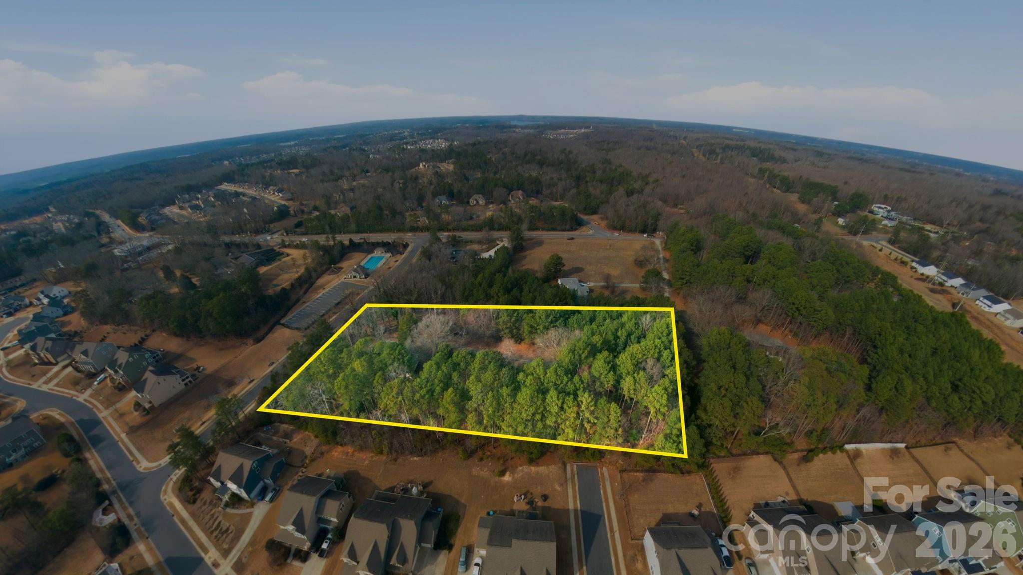 A rare development opportunity in one of Charlotte’s fastest-growing corridors. 16716 Watermelon Lane offers 3.14 acres of land in the desirable Steele Creek/Lake Wylie area, surrounded by new construction, infrastructure expansion, and long-term growth planning. The property is being marketed strictly for its land value and development potential.

Positioned within the N1-A zoning district, this tract allows for residential dwellings on lots of 10,000 sq ft or greater, creating a clear path for a small subdivision, estate-lot community, or a strategic hold for future appreciation. With three potential road access points, the site provides flexibility for layout, traffic flow, and builder-friendly design.

Utility access is already nearby—Charlotte Water’s 8-inch PVC line borders the property, significantly reducing development hurdles and improving feasibility for multiple homesites.

Located just minutes from Lake Wylie, The Palisades, and the rapidly developing River District, this property sits in a high-demand pocket known for its blend of natural beauty and modern growth. Shopping, schools, recreation, and major transportation routes are all within easy reach.

Whether you’re a builder, investor, or long-term planner, this acreage offers the rare combination of zoning, access, and location that makes projects pencil.

Land only. Home conveys at no value.