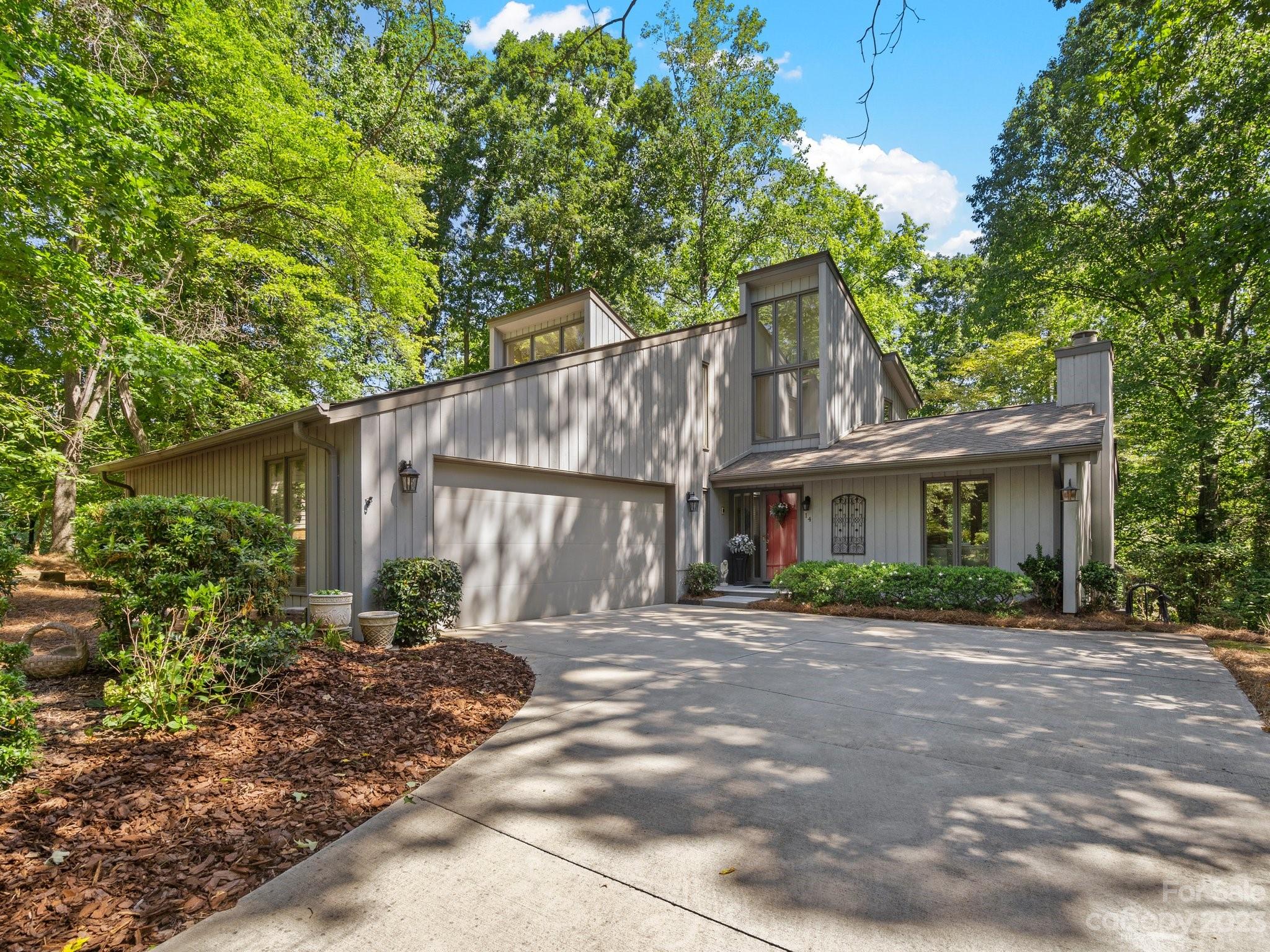 This lovely home sits at the end of a cul-de-sac with golf course view and seasonal view of Lake Wylie in the winter.  Kitchen with stainless appliances, granite countertops open to dining room, sunroom and great room with vaulted ceiling and gas log fireplace. Nice deck off sunroom for your outdoor cookouts, sipping coffee, tea or your favorite beverage while listening to the birds sing.  The sunroom is where you will want to sit and read and enjoy nature just outside the windows.  Primary bedroom on the main level .  Primary bath has a walk in shower, separate bathtub and double vanities.  Hardwood floors in entry way, kitchen, dining room and sunroom on the main level.   Upstairs you will find two large bedrooms and a remodeled bathroom. plus a bright loft area with built in computer desk - a perfect place to work from home or do your homework. Large walk in attic space for storage.  Oversized garage with a work shop area.   This home has been lovingly maintained and it shows.