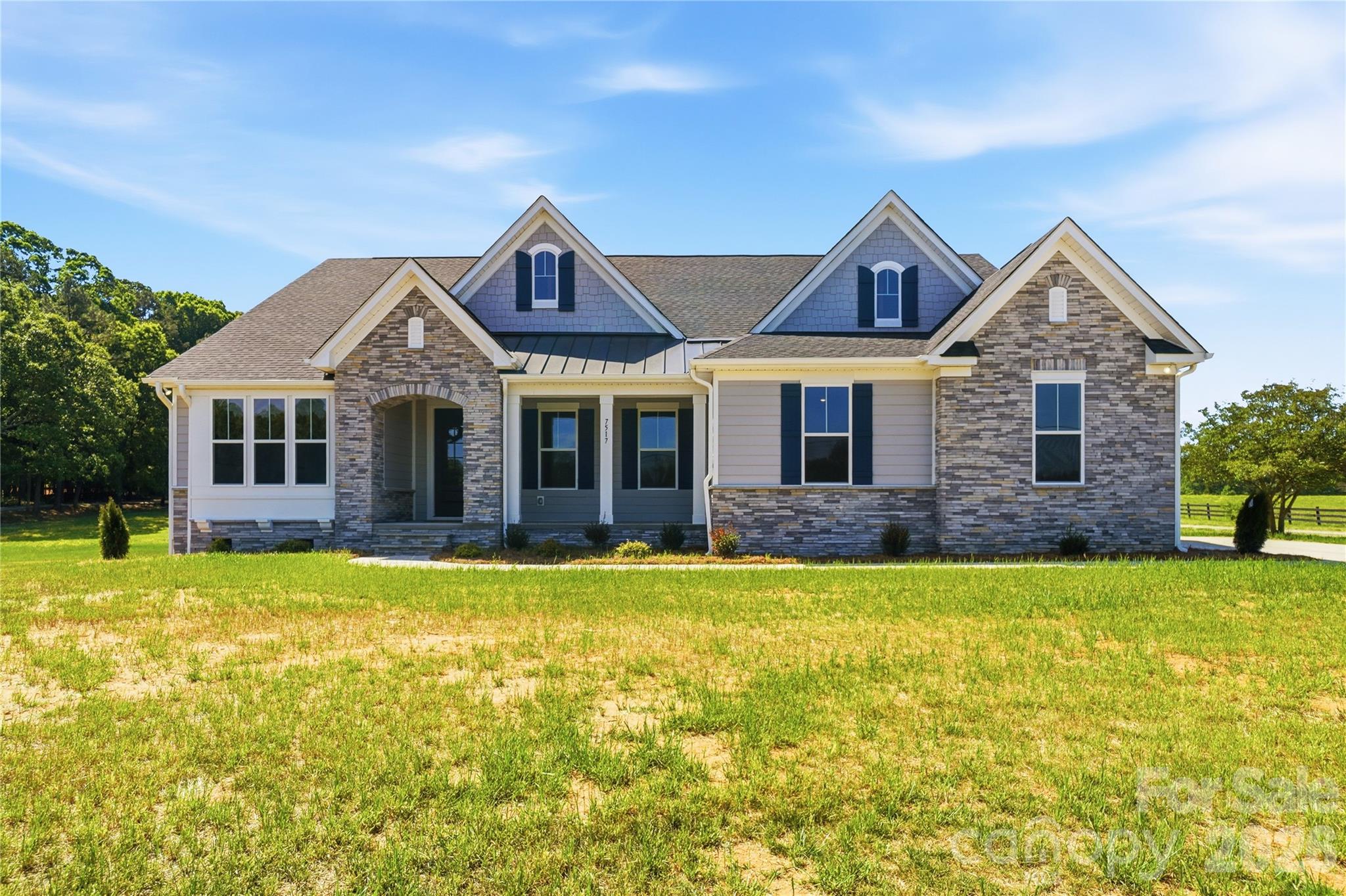 **Price Improvement + Builder Incentives!** Now offered at $675,00 plus up to 3% toward closing costs with the use of the builder's preferred lender and attorney.

Welcome to the Charleston Plan, a thoughtfully designed new construction home offering space, flexibility, and exceptional value in desirable Waxhaw. Situated on a spacious homesite just minutes from Downtown Waxhaw, this move-in ready home combines peaceful surroundings with convenient access to local shops, restaurants, parks, and community events.

The inviting floor plan features a formal dining room and a flexible front room perfect for a home office, sitting area, playroom, or additional living space. The bright family room showcases a dramatic wall of windows and flows seamlessly into the gourmet kitchen, complete with an oversized island, abundant cabinetry, and a sunny breakfast area ideal for everyday living and entertaining.

The private owner's suite offers a spa-inspired retreat with dual vanities, a walk-in shower, and two spacious walk-in closets. A convenient drop zone off the garage helps keep daily life organized. Upstairs, approximately 996 square feet of unfinished space provides endless possibilities for future expansion, including a bonus room, media room, home gym, or storage.

An added bonus-there are two brand-new homes available side by side, giving buyers a rare opportunity to compare floor plans and choose the home that best fits their needs.

Don't miss this opportunity to own brand-new construction with valuable builder incentives in one of Union County's most sought-after locations.