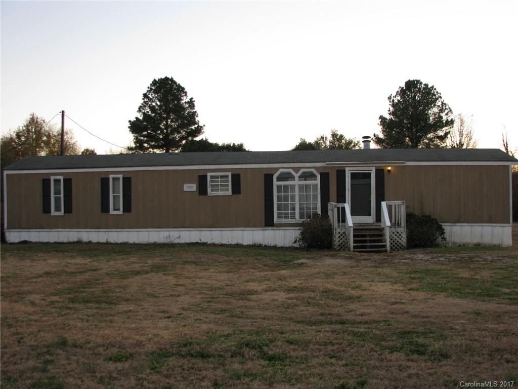 This 2 bedroom/2 bath home needs a little TLC. It has beautiful hardwood floors throughout and a cozy fireplace in the living room. The cabinets and fixtures were all replaced about 3 years ago. This home is priced to sell and ready for a little paint and love. Selling as-is.