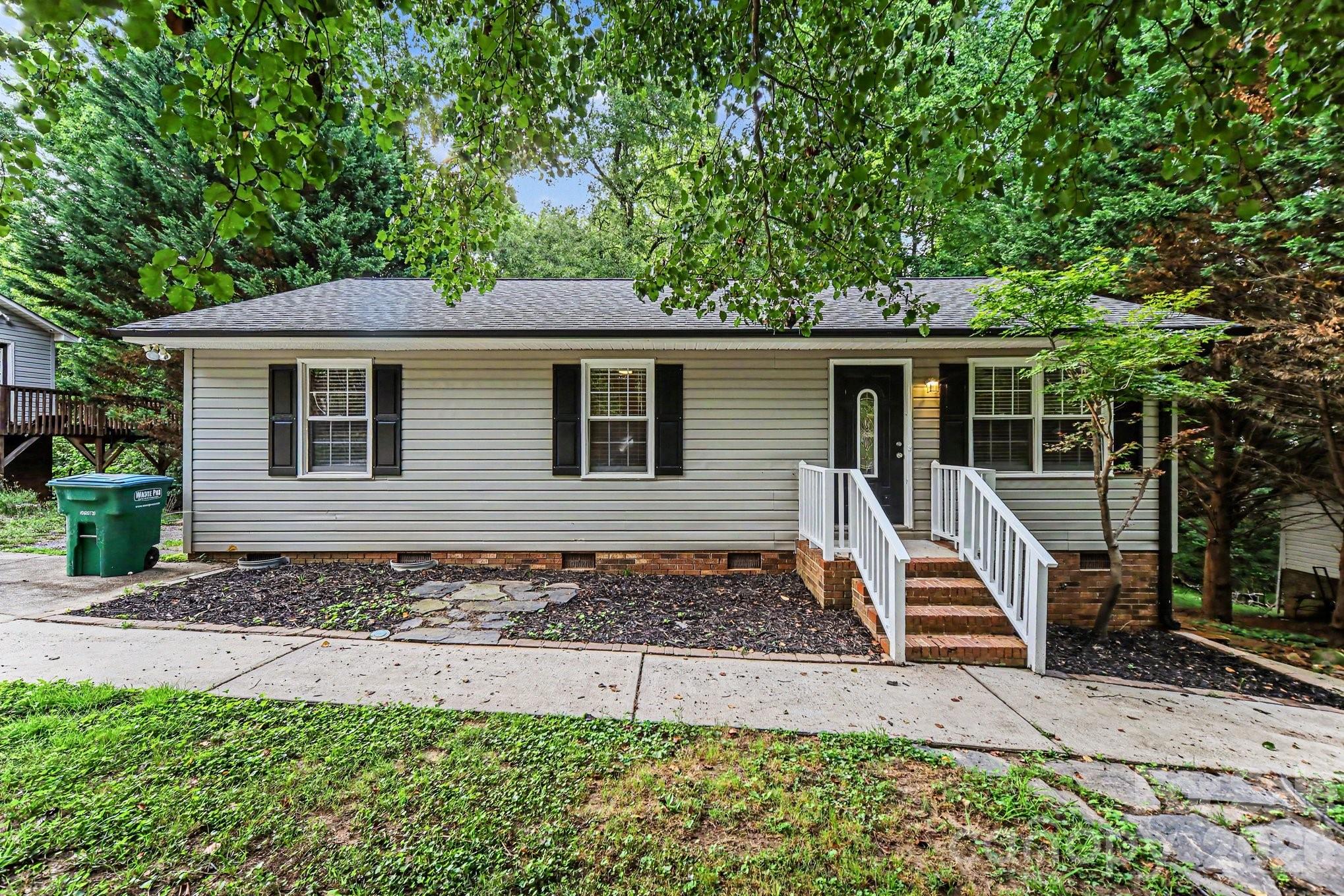 This charming 3-bedroom, 2-bathroom ranch-style home offers the perfect blend of classic comfort, modern updates, and effortless single-level living. Step inside to an inviting layout finished with sleek, low-maintenance vinyl/laminate flooring through the main living areas, providing excellent durability and quick cleanup for high-traffic zones. The heart of the home showcases a contemporary kitchen fully equipped with a matching suite of stainless steel appliances, creating a stylish and highly efficient space for all your meal preparation. Designed with comfort in mind, all three bedrooms feature cozy, plush carpeting underfoot, creating warm and quiet personal retreats. Offering zero stairs to navigate and broad market appeal, this turn-key ranch is thoughtfully optimized for easy, low-maintenance living.