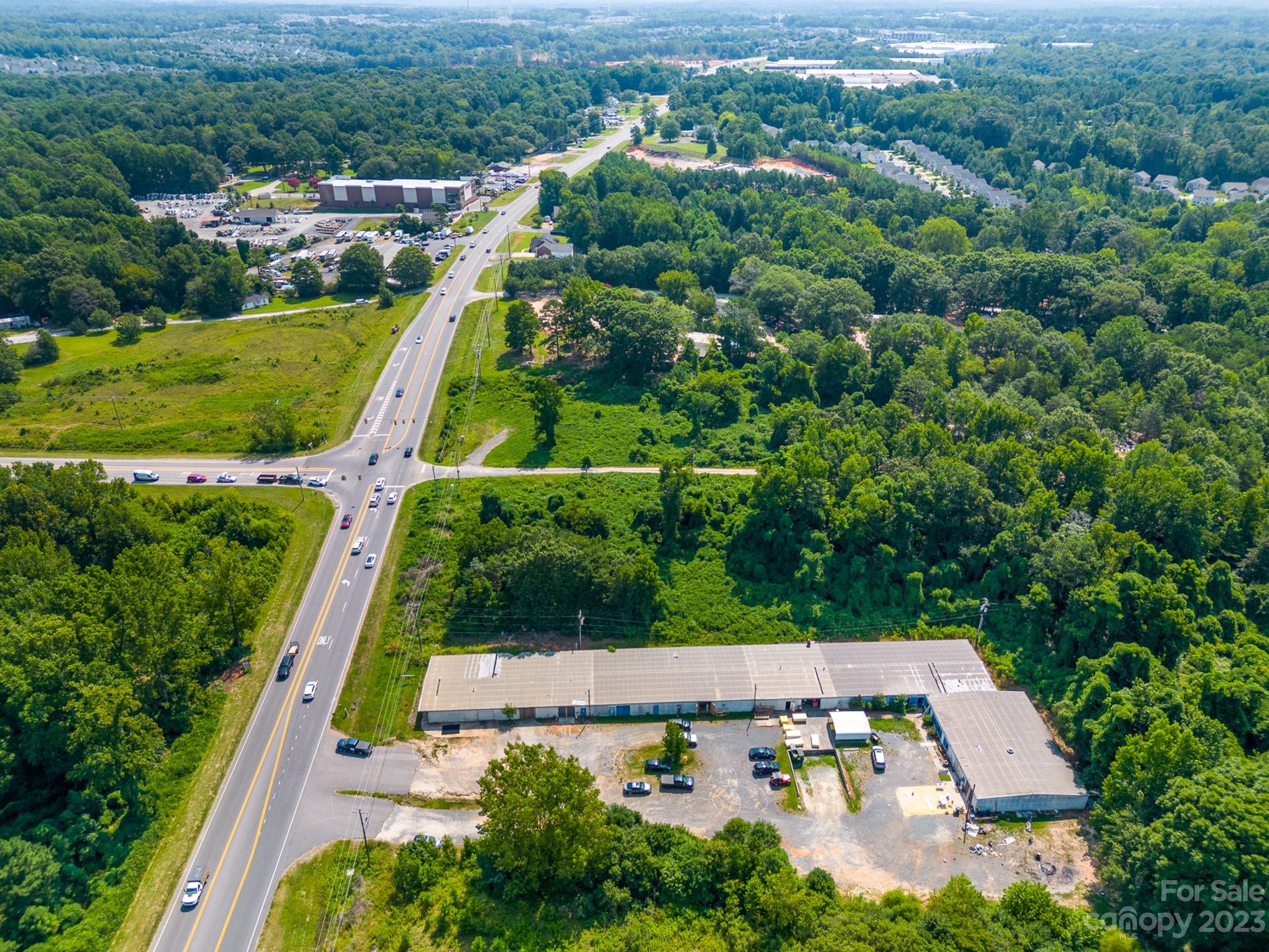 Here's a great opportunity with easy access to Charlotte, FT Mill, and Rock Hill.  This is just minutes away from the Ballantyne area.

There is a warehouse with just over 22,000 sq ft and is partially rented out.  There are 18 bays.  Tenants are month to month.  There is plenty of room for parking.  There are many opportunities to run a business out of here or start from scratch. Check with zoning on what you would like to build or what businesses are allowed.