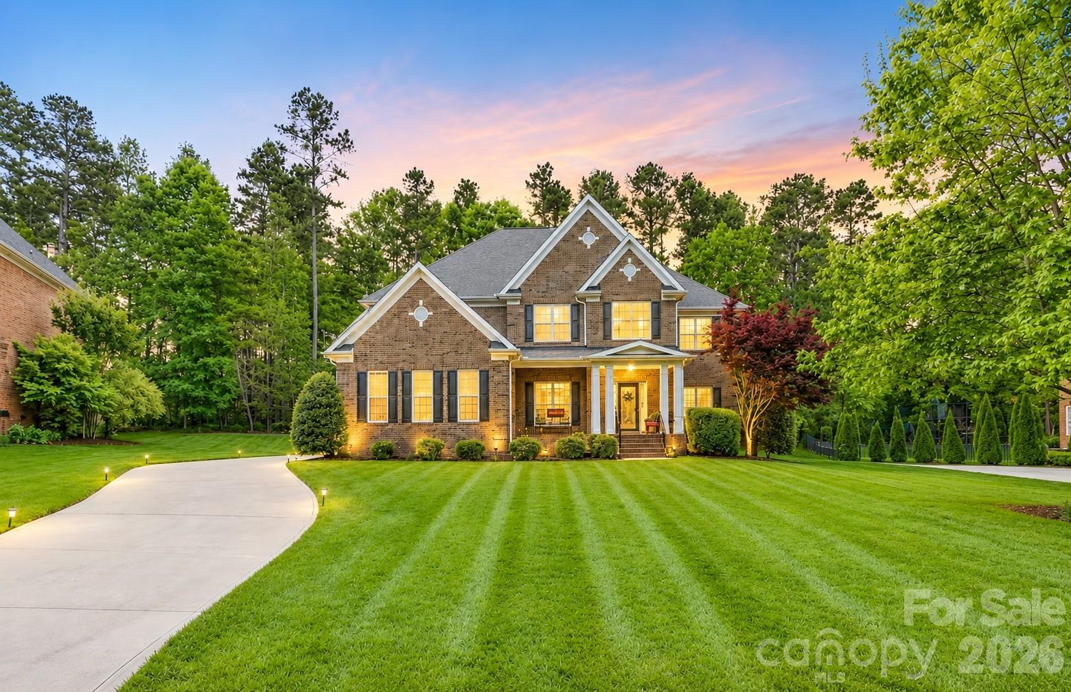 Full brick estate home available in the Weddington High School district! 4BR/3.5BTH w/large bonus room & 3 car side load garage. Premium .86 acre lot is one of the largest in the Estates. Extensive hardwoods on main. Open flr plan w/gorgeous chef's kitchen, Zodiac quartz tops, huge island, stnls GE Profile apps, dbl oven & walk-in pantry. Large formal dining rm, livng rm & great rm w/fireplace. Private ofc w/French doors. Dual staircases. Upstairs spacious owner's suite, huge bath w/ walk-in shower, oversized tub & his/her closets. 3 more spacious bedrooms plus huge bonus rm! Kid's wing w/ Jack-N-Jill. Gorgeous homesite with tons of privacy, backing to woods. Less than 5 mins to Target, Chick-Fil-A, Harris Teeter, PetSmart, Hickory Tavern & Dunkin and a new Publix. The Estates-a quiet, mature, all brick community of 65 homes. Close by but country feel.