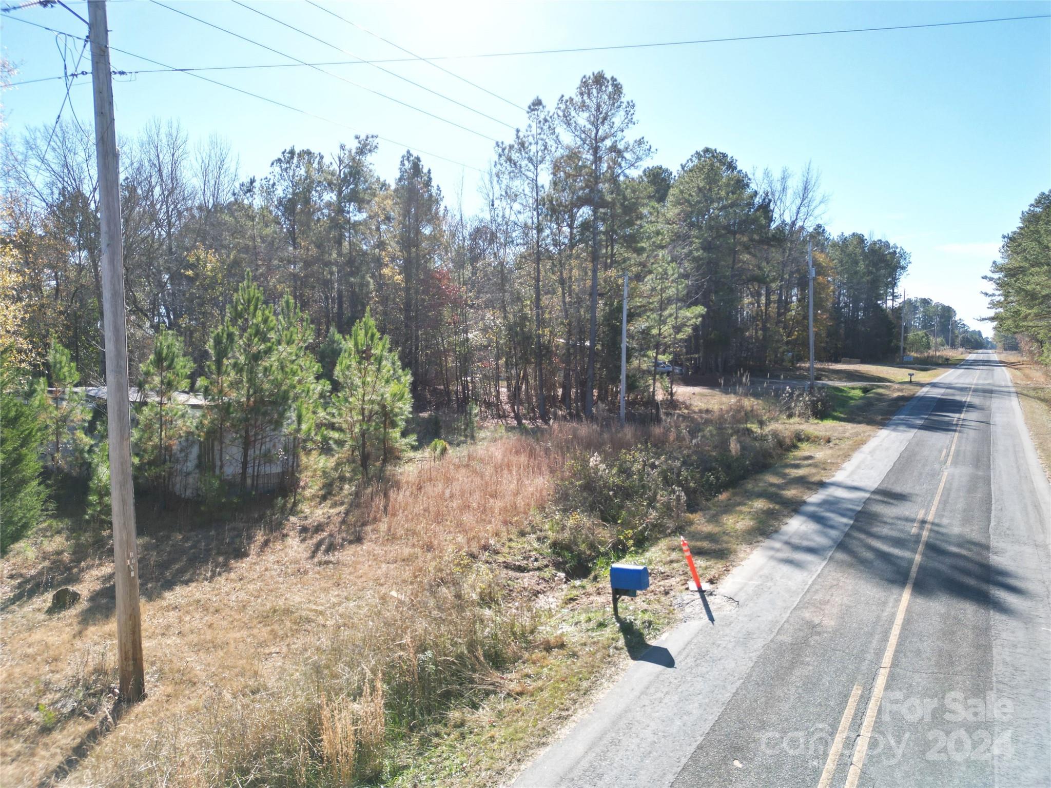 This lot has an abandon 2 bedroom manufactured home that was connected to power and county water.
New septic permit may be required for more than 2 bedrooms. Adjacent Lot 1 is priced at $15,000.
Former Address : 772 Dr. Wyatt Rd,  Lilesville, NC.