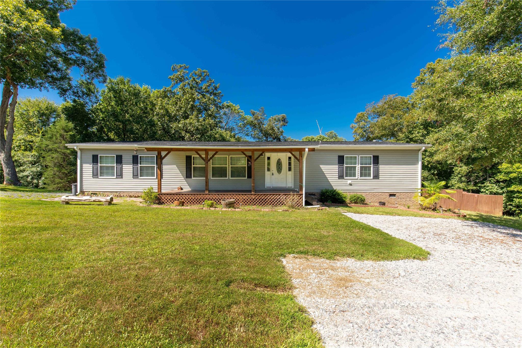 Welcome to 174 Little Pine Dr, Smyrna, SC! This stunning 3-bedroom, 2-bathroom home, built in 2014, offers modern comfort and serene living on over 11 acres of private land. The custom kitchen boasts stainless steel appliances, perfect for culinary enthusiasts. Enjoy the luxury of new carpet throughout, and a split floor plan for added privacy. Each bedroom features spacious walk-in closets, while the large laundry room adds convenience to your daily routine. The primary bathroom is a retreat, complete with a custom shower, garden tub, and double vanity. The fenced-in backyard is ideal for pets or outdoor entertaining. Located just minutes from SC-5 and I-85, this property combines tranquility with easy access to major routes. Don't miss the opportunity to make this your dream home!