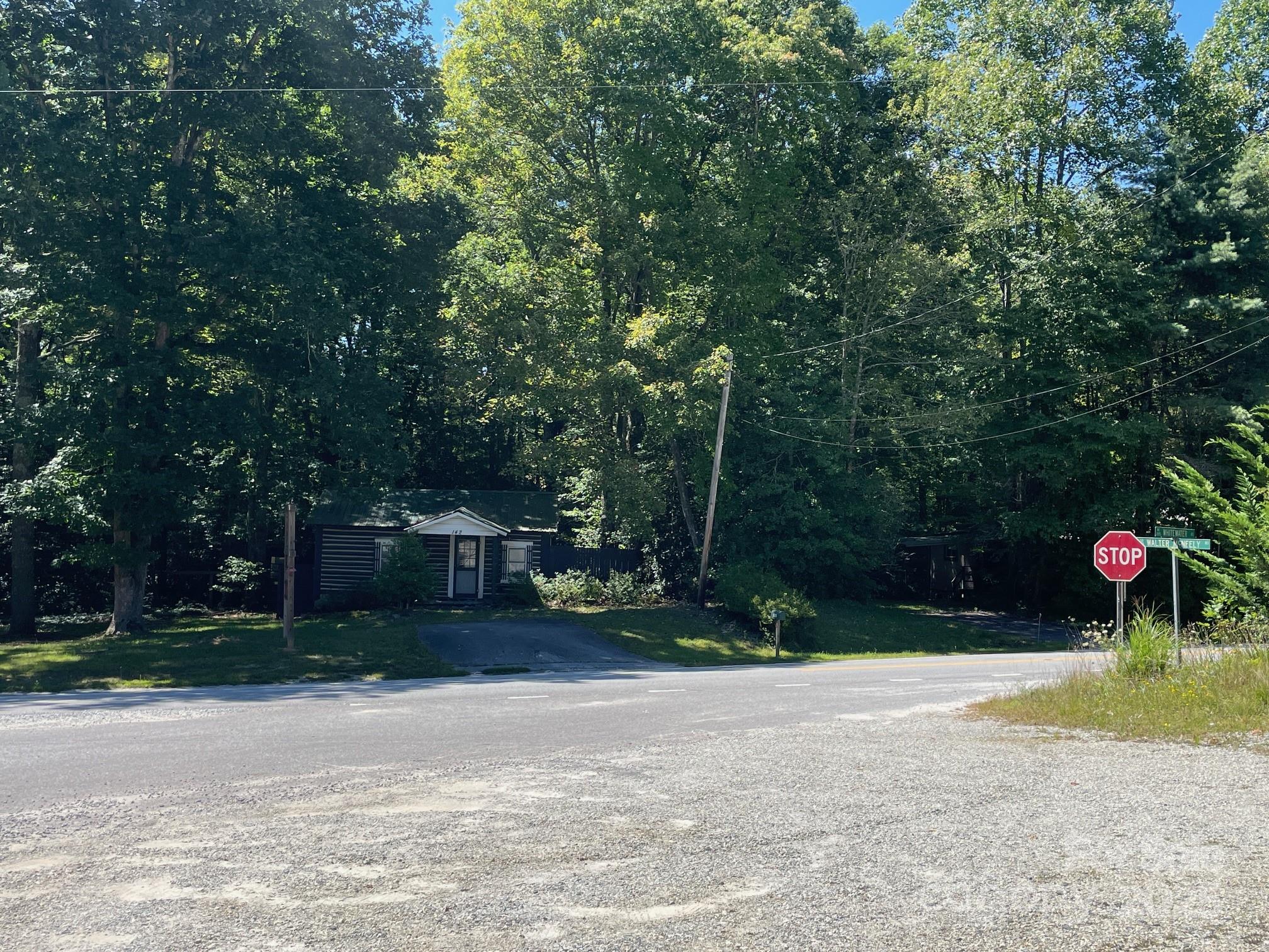 Two homes here and a vacant lot make up 2.35 acres along Hwy 281 S with 540' of road frontage! Over the years the homes have been used for commercial and residential use. The future possibilities are endless for the new owners to decide. Small cabin is 1 bed/2 bath, larger cabin is 2 bed/1 bath with a large covered front porch and carport. To the left of the small cabin is a .45 acre vacant lot that can be developed. The location for this parcel is key, only about 1 mile to Gorges State Park and just up the road from a convenient store with a restaurant. Only a short distance to Brevard and Cashiers, this property is located between both. Again, the possibilities of this property are endless so make an appointment today to see it.