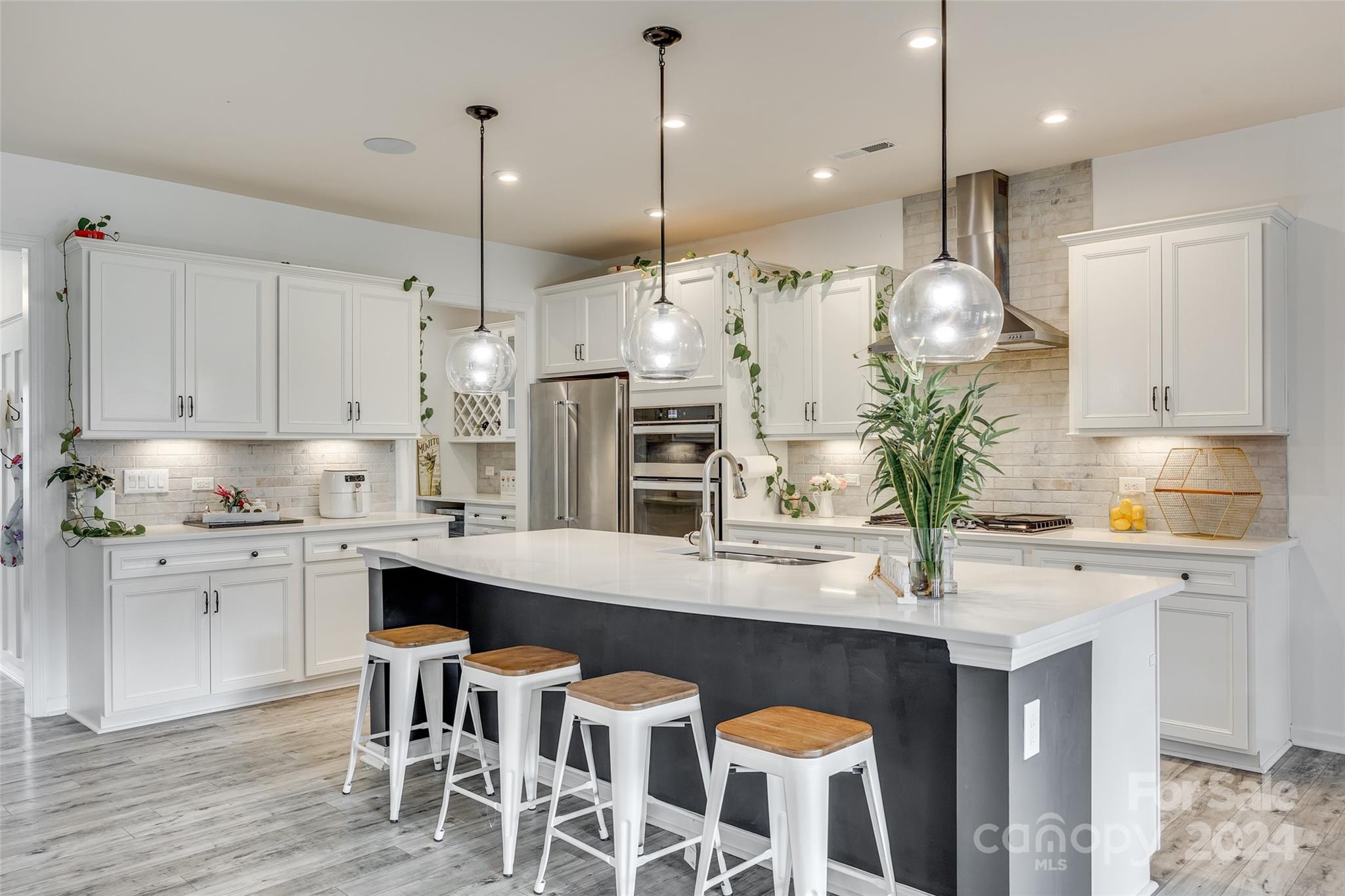 Welcome to the charm & elegance of this home on a 1/3 acre in sought-after McCullough. Timeless details meet modern comfort in this 5 bedroom, 4 bathroom floorplan featuring show-stopping kitchen, custom moldings, spacious great room, & smart home features. Working from home is a breeze in the home office w/ drop zone. The main floor suite offers a warm welcome for guests, ensuring that every visit feels like a cherished occasion.  Upstairs boasts 4 sizable bedrooms including the primary suite that feels like a private retreat as well as an enclosed bonus room that is currently being utilized as a home theater, bringing the magic of the movies into the comfort of your own home. Unwind on the covered porch, sharing quiet moments as the day fades. Finally, the neighborhood amenities are abounding with 2 pools, trails, courts, &  is convenient to downtown Pineville with the benefit of South Carolina taxes & award winning schools. 3D Tour: https://my.matterport.com/show/?m=6XxGP4cUAra