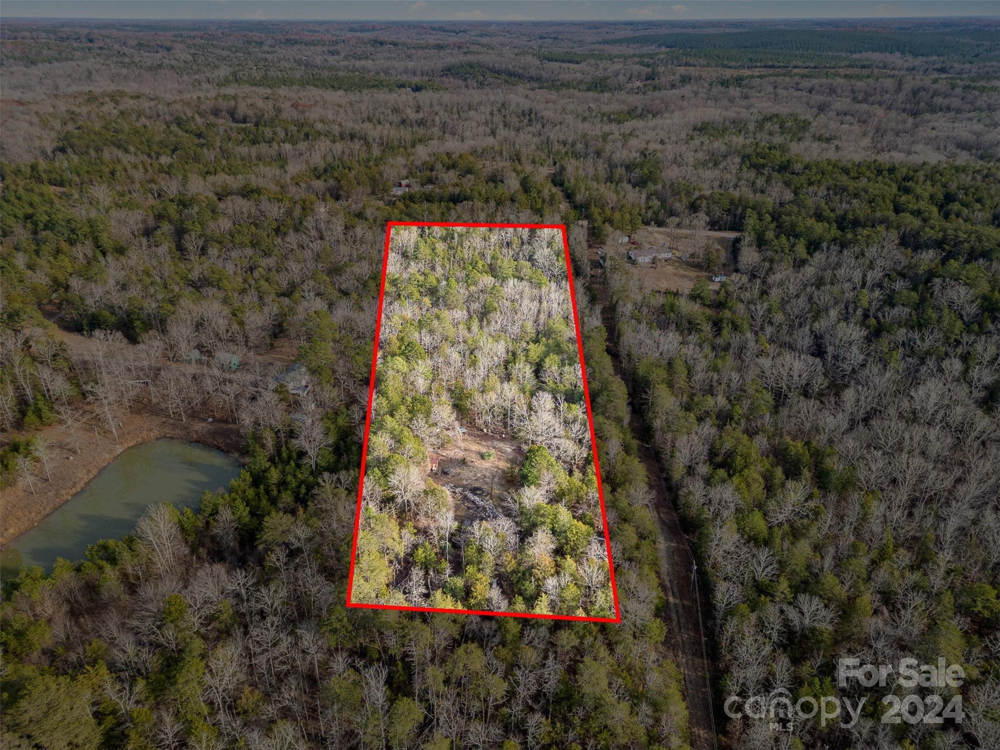 6.94 Acres in a remote and private setting. This is a Nature Lover's dream.  With wild Turkey and Dear roaming the land. This property is a rare gem. Come and build your dream home and make it your own.  This property has a shared driveway with 940 Turkey Creek Ridge Road. Well, Septic and Power installed and ready to go. Manufactured Homes are allowed. Please do not enter the property without an appointment.  4 wheel drive recommended.