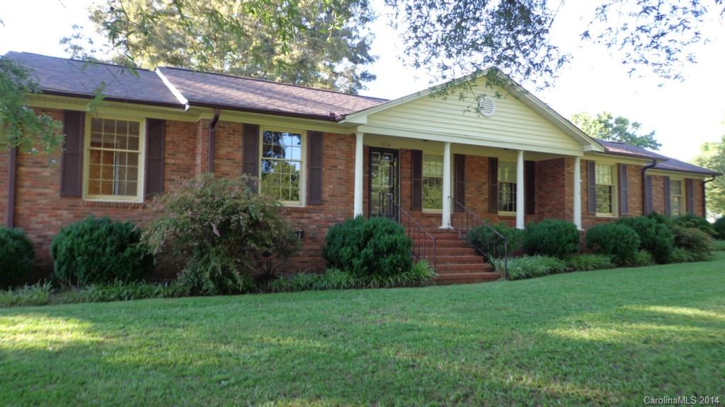 Bring the rocking chairs to this well-maintained brick ranch on lg mature landscaped lot conveniently located to Rock Hill, York, McConnells & Chester. The formal LR, DR and family room with fireplace with the new roof, updated bathrooms, new flooring fresh inside paint, screened porch, wired workshop & a place for a garden make it home sweet home!