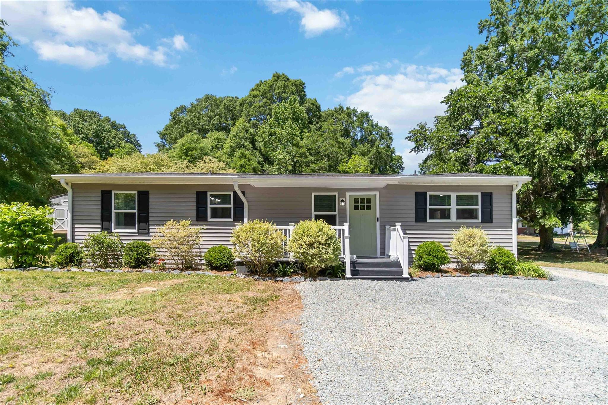 Super cute home that sits on about a half acre lot with shed and plenty of parking - plus, NO HOA!!! Home has a beautiful kitchen with granite countertops, stainless steel appliances and backsplash to make this kitchen a dream. Bathroom has plenty of room and has been updated. Backyard is fenced around the back of home and the rest of the yard is open. Don't miss this one in Locust!
