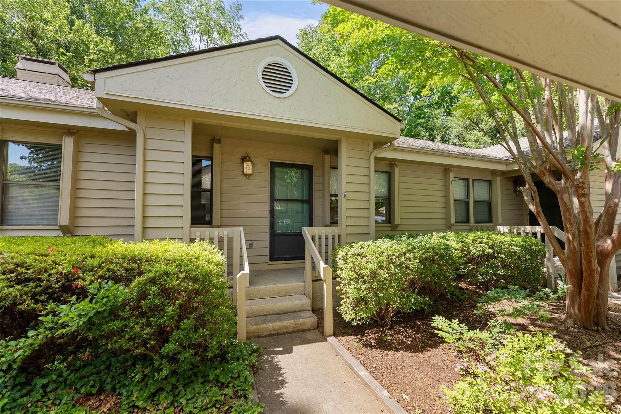Welcome to the Cloisters! This middle unit cluster home has all of the convenience of an Asheville address, carport for parking, and simple one level floor plan for easy living. As you walk inside you'll find a 2 bedroom, 2 bath, split floor plan with large rooms, closets, and beautiful surroundings. In the kitchen you'll find an easy design, with ample cabinets, and large L shape cabinet bank. The formal dining area is divided from the oversized living room by a cozy gas fireplace insert, and also has a large skylight to bring the outside in. In the back of this unit there's an enclosed patio space that spills into a communal backyard area. The neighbors take pride in ownership, and this active lifestyle community includes a large inground pool, shuffleboard, community grills, clubhouse, and pickle ball courts for residents to enjoy. This home is looking for it's new owner, and located in a quiet part of the community this blank slate is just waiting for your final touches to make it home.