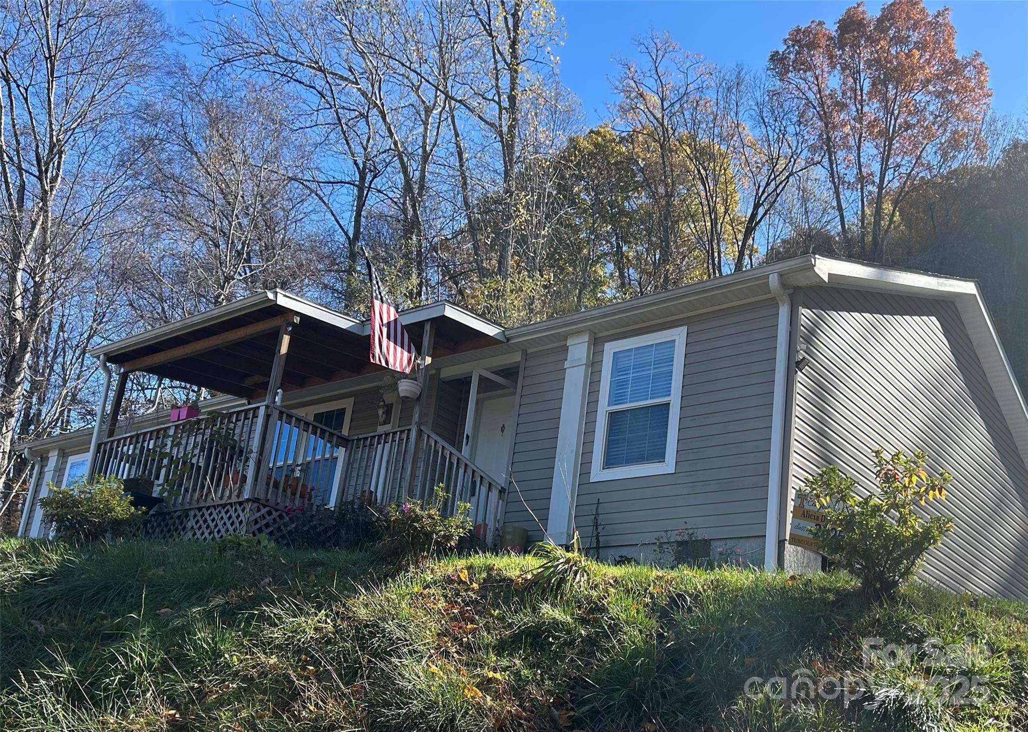 Spacious Home with Year-Round Access Near Waynesville, Maggie Valley & the Great Smoky Mountains

Welcome to your new mountain retreat! This beautifully maintained home offers year-round access and a central location close to all the area’s most popular attractions and amenities. Enjoy easy drives to Cherokee, Maggie Valley, Waynesville, and the Great Smoky Mountains National Park—perfect for those who love scenic views, outdoor adventures, and small-town charm.

Step inside to discover an open-concept floor plan designed for comfort and functionality. The bright and airy living area flows seamlessly into the kitchen and dining spaces, making it ideal for entertaining family and friends. The kitchen offers ample cabinet space and modern appliances, ready for your favorite home-cooked meals.

The primary bedroom suite is a true retreat, featuring double sinks, a separate shower, and a luxurious soaking tub—perfect for unwinding after a day of exploring the Smokies. Additional bedrooms provide plenty of space for guests, a home office, or hobbies.

This well-kept home has been lovingly cared for and is in excellent condition—ready for you to move right in. Outside, you’ll find a peaceful setting with room to enjoy the fresh mountain air year-round.

Whether you’re looking for a full-time residence, vacation home, or investment property, this home checks all the boxes. Well-priced and ready to go, it’s a wonderful opportunity to own a piece of mountain living close to everything Waynesville has to offer.