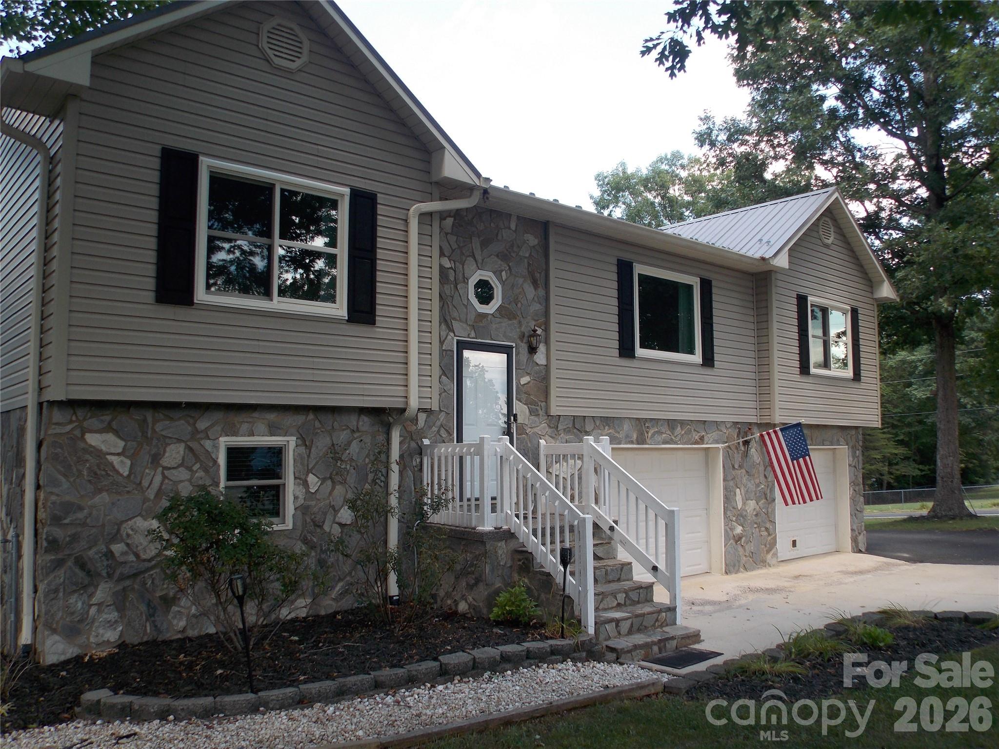 BEAUTIFUL and WELL MAINTAINED  3 bedroom 3 bath home with hardwood floors, new carpet in bedrooms, gas logs in the finished family room in basement, new windows, spacious for large family or family visits with grand kids, Cool off and enjoy the above ground pool with deck and sitting area (seller is leaving all pool equipment including robot cleaner), large heated and cooled 20 x 30 garage for any hobby, Covered RV parking as well, nice building for tools also has power, tons of extras, Beautiful shaded yard in a  great neighborhood!  Very Convenient location, close to shopping, restaurants, and mountains. Come make this your home!