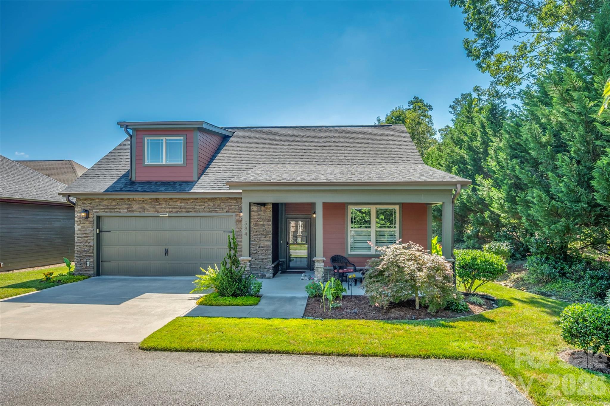 Low-maintenance living can be yours in this freestanding patio home, tucked away at the end of the street for maximum privacy. The living room features an elegant tray ceiling and a gas fireplace, all within an open floor plan that flows seamlessly into the kitchen and dining area, ideal for entertaining guests.

This immaculately maintained home offers a kitchen and dining space equipped with abundant cabinetry, gas stove, granite countertops, a large pantry, and a convenient breakfast bar. The primary suite is quite spacious and includes a walk-in closet with a nice organization system, along with an en-suite that features double sinks and a tiled step-in shower. Attached to the primary suite is a cozy, unheated sunroom that provides direct access to the patio and has a small pet door.

Additionally, there is a large office or flex space, a mudroom and a laundry room with a utility sink.  You will also find ample storage with numerous closets and a 10 X 19 floored attic space, complemented by thoughtful additions like metal gutter guards, a retractable screen on the garage entry door, tankless water heater, a mini water heater in the guest bath for quick hot water supply, sun tunnel in the mudroom and a roll down shade on the exterior living room wall to filter the sunshine on those really hot days.  Vinyl privacy fencing is on the rear and side, plus there is a small area for a few vegetables and flowers.  Easy care flooring choices consist of engineered hardwood and tile throughout.

The community provides excellent amenities including a clubhouse, fitness center, outdoor pool, and a scenic pond with a pavilion. Since the HOA covers all exterior maintenance, you are free to spend your time enjoying the amenities. As a bonus, you are just minutes away from shopping, dining, and the charm of downtown Hendersonville.