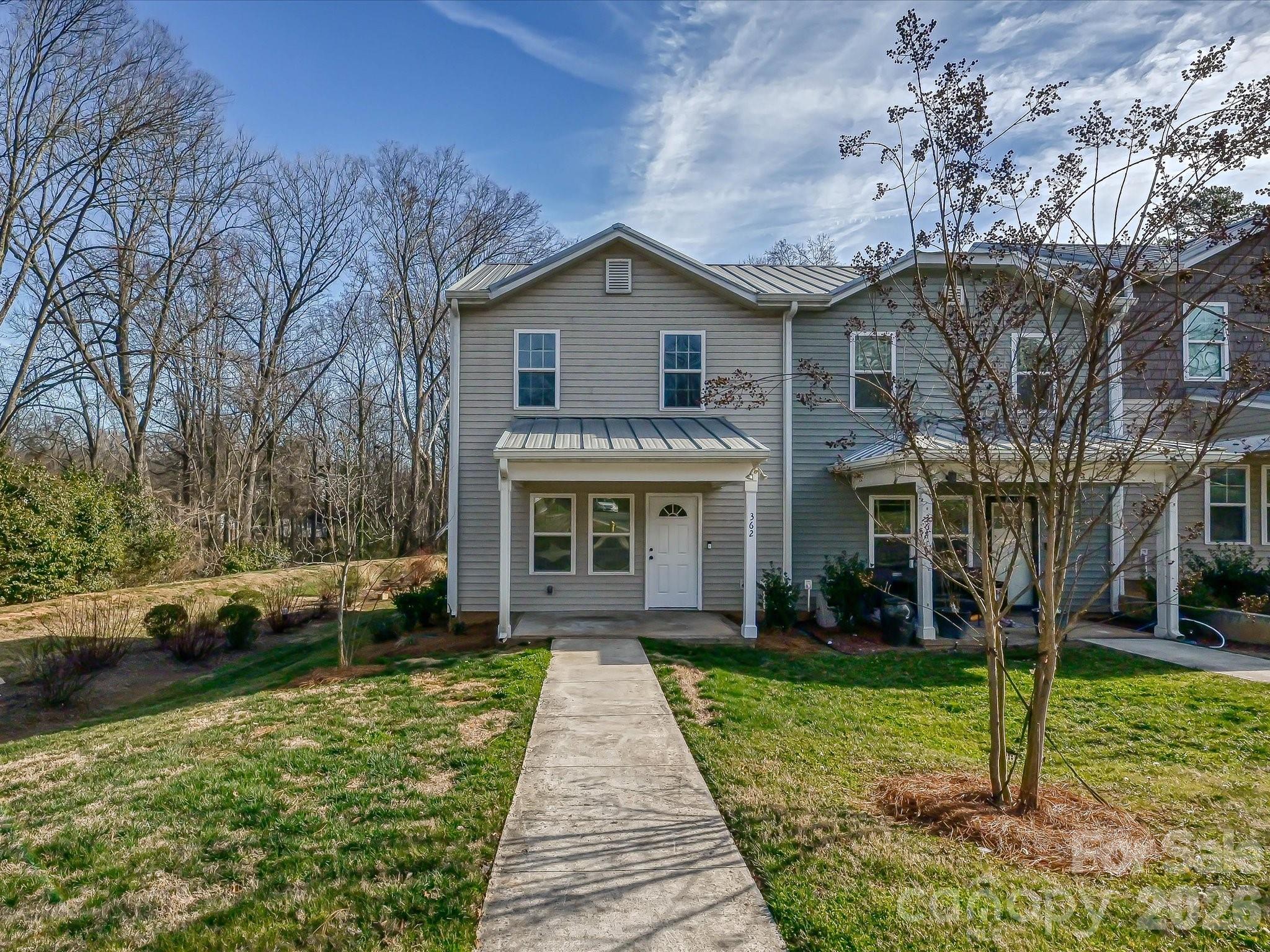 362 E Mills Ave is a charming end-unit townhome set among mature trees with a private parking lot just steps from the back door, offering a peaceful, low-maintenance retreat in the heart of Mooresville.
Inside, the home features a bright, open layout with hard surface vinyl flooring throughout, a kitchen with new stainless-steel appliances, and rich dark brown cabinetry that adds warmth and depth to the space.
Just steps away, Nesbit Park offers a welcoming green escape for morning walks and quiet afternoons, while Willow Valley Nature Preserve and Glenwood Memorial Park are both just nearby — giving you plenty of options to get outside and unwind surrounded by nature.
The walkable Merino Mill business park on S Main St is just around the corner, home to local favorites like Barcelona Burger & Beer Garden, Alino Pizzeria, Defined Coffee, and The Mill Cyclery. Beyond that, quick access to I-77 and downtown Mooresville puts shopping, dining, and the shores of Lake Norman all within easy reach.
A vibrant Mooresville lifestyle, with everything you need just outside your door.