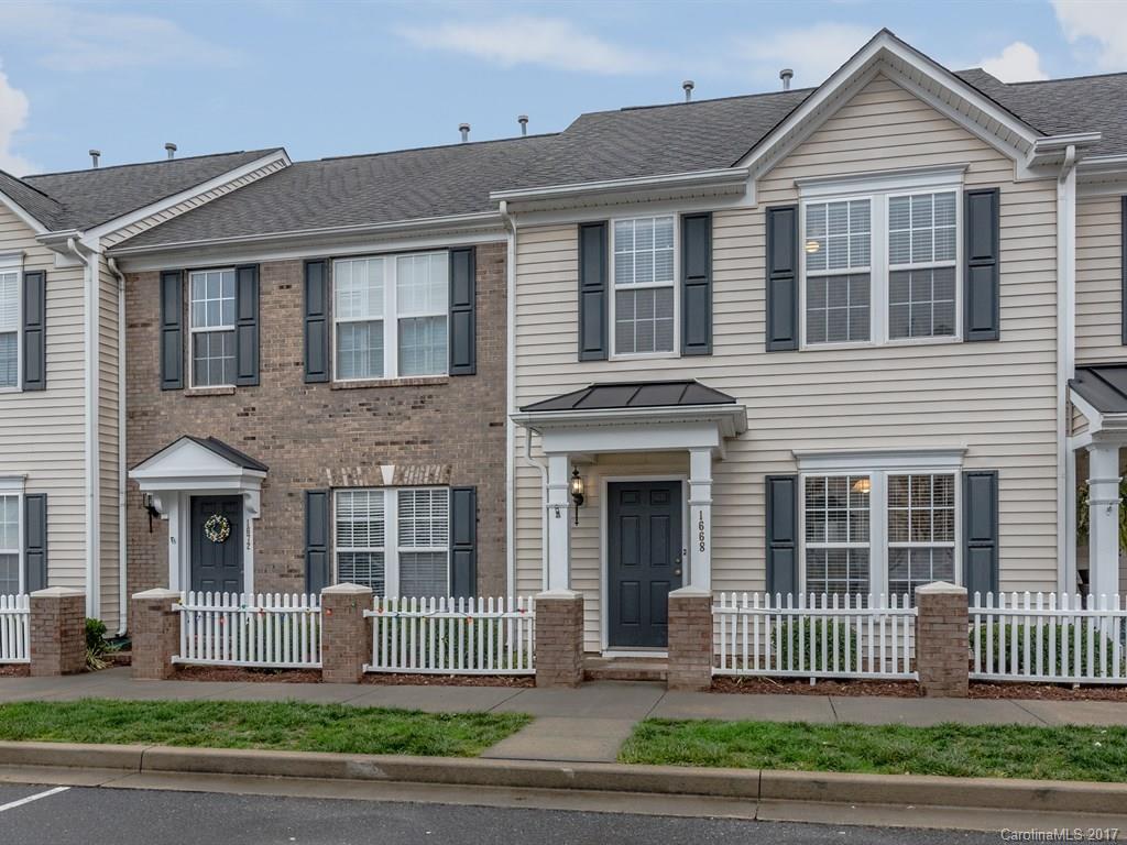 Wonderful home w/covered front entryway in desirable neighborhood w/amenities and easy access to I 77, shopping & restaurants. Home features upgraded flooring; only the stairs are carpeted; 42" rich cabinets in the kitchen; vaulted ceiling in the sun room; 2 spacious master bedrooms w/private en-suite bathrooms; one master has a tray ceiling, walk in closet, & new tub w/shower surround; ceiling fans in bedrooms & living room.  Patio & detached shed in the back w/view of mature wooded trees.