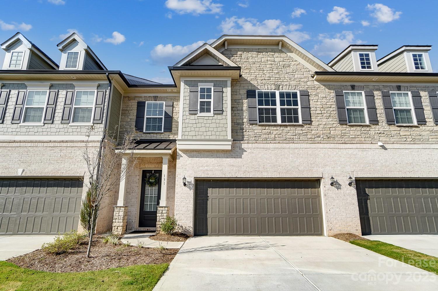 This luxurious townhome features a sophisticated chef's kitchen with white cabinetry, chic quartz countertops, well-appointed appliances, and a walk-in pantry. Custom upgrades throughout the home include wall panels, a drop zone, wood floors throughout, custom shelving in all closets and pantry, lighting, a coffered ceiling in the spacious living room, and many more. The true owner's retreat has a separate sitting area, a private balcony overlooking the woods, a spa-like bath, and 2 walk-in closets. There are 2 more bedrooms with ensuite bathrooms. Short distance to Blakeney and Waverly Shopping and I-485, award-winning schools. Refrigerator, washer/dryer included as well as water and lawn care. Please do not disturb the current tenants.