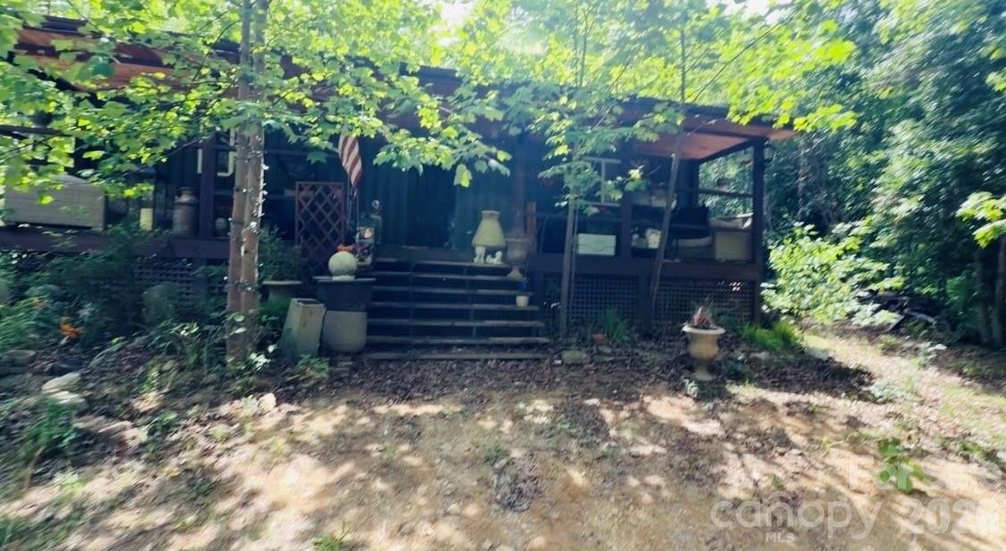 Hidden away in the mountains of Lake Lure, this rare 31.01+/- acre unrestricted property offers the perfect mix of privacy, adventure, and mountain beauty. Featuring approximately 315+/- feet of frontage on bold, rushing Cedar Creek, this land is ideal for those dreaming of a private estate, recreational retreat, hunting property, family compound, or mountain getaway. Previous MLS history described the creek frontage as “bold” and “rushing,” creating a truly peaceful natural setting. 

The property offers multiple potential building sites surrounded by mature hardwoods, mountain wildlife, and wooded acreage. Previous MLS information noted deer, turkey, and bear have all been seen using the property, making it an excellent option for hunters, outdoor enthusiasts, or anyone looking to unplug and enjoy nature. 

Already situated on the property is a mostly completed cabin that offers an incredible opportunity to create your own custom mountain retreat. The exterior structure is largely in place, while the interior remains unfinished and ready for the next owner’s vision and finishing touches. Solar possibilities have already been started, and the property also includes a cistern system. Seller and listing firm make no representations regarding permits, condition, functionality, utilities, solar components, cistern system, or completeness of any improvements currently on the property. Buyers are encouraged to verify all information independently.

With no restrictions and no HOA, the possibilities are wide open. Bring your vision for a private mountain homestead, hunting camp, recreational escape, tiny cabin retreat, off-grid getaway, or multi-generational family compound. The property also offers potential timber value along with endless opportunities for recreation and exploration.

Located just a short drive from Lake Lure, Old Fort, Asheville, hiking trails, waterfalls, and endless outdoor recreation, this property gives you the feeling of being completely tucked away while still remaining accessible to nearby towns and attractions. 

Access is by right-of-way and creek crossing. A bridge is not currently in place, and a 4x4 vehicle with good clearance is recommended for access and showings.
