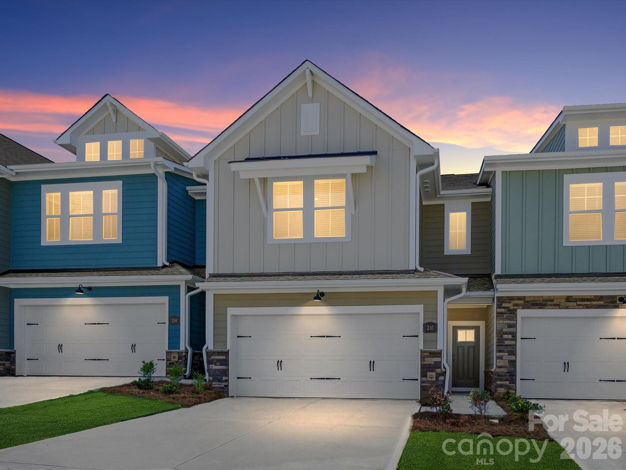 Discover the ease of luxury low-maintenance living in this brand-new Mecklenburg II townhome, conveniently located just minutes from Ballantyne, Waverly, and the charming shops and restaurants of historic downtown Waxhaw. Filled with natural light, the open-concept living area is highlighted by three large picture windows overlooking a private wooded backyard. The designer kitchen features 42” White colored soft-close cabinetry, sleek honed granite countertops, a spacious shiplap wrapped island open to the family room, Frigidaire stainless steel appliances, an exterior-vented range hood, and a pantry with solid shelving. The main level showcases durable LVP flooring throughout, along with composite stair treads leading to the second floor. Upstairs there is a loft area with LVP flooring, unwind in the luxurious Owner’s Retreat featuring a tray ceiling, oversized walk-in closet, and three large windows that create a bright, airy feel. The spa-inspired primary bath offers tiled flooring, a large tiled walk-in shower with bench seating, oversized dual vanity with quartz countertops and soft-close cabinetry, a linen closet, and a private water closet. The second floor also includes two spacious secondary bedrooms, a full hall bath, and a thoughtfully designed laundry room with tiled flooring and a convenient folding table. Enjoy peaceful mornings or relaxing evenings on the covered porch with private backyard. A side-by-side two-car garage and full driveway provide ample parking for both homeowners and guests. With low taxes, low-maintenance living, and the feel of a single-family home, this townhome offers the perfect blend of comfort, convenience, and style. Ask about special low-interest rate opportunities!