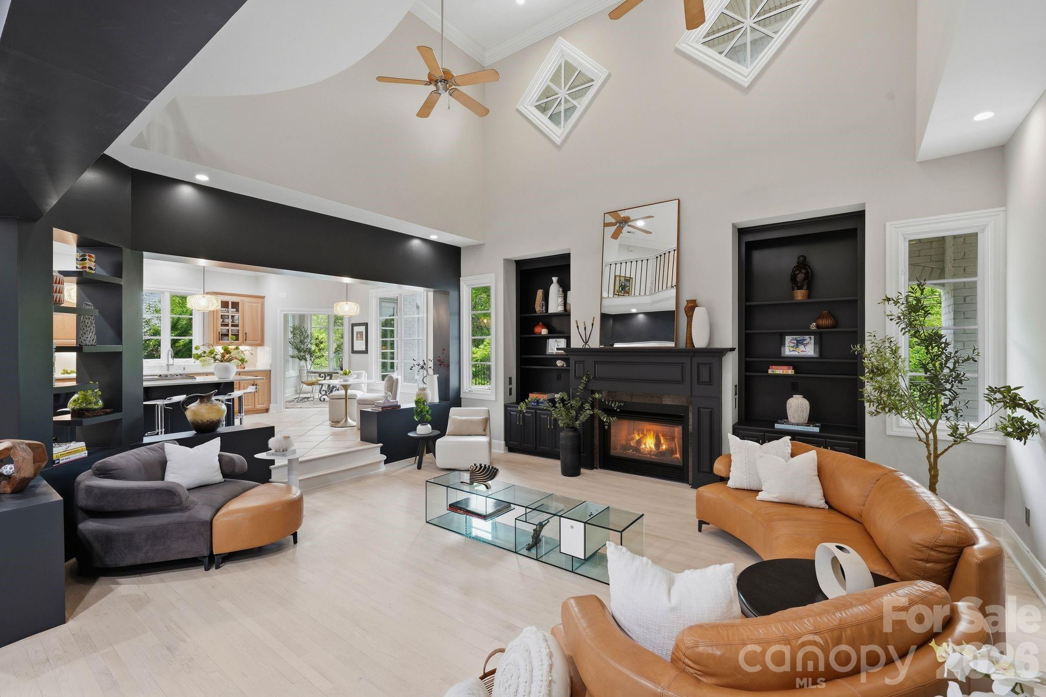 A rare Myers Park offering with a FULLY FINISHED BASEMENT & private ELEVATOR access to all 3 levels!  This newly renovated estate commands attention from the moment you arrive. Gracefully positioned on a private half-acre cul-de-sac lot, it seamlessly blends timeless architecture with modern refinement. The exterior facade sets the tone- an unforgettable statement of elegance and architectural distinction. Grand neoclassical columns anchor a stately, symmetrical portico, while the elevated positioning enhances both presence and curb appeal.  A secondary-level balcony adorned with intricate wrought iron railings adds a refined touch, complemented by graceful arched windows and classic dormer accents. The paver driveway leads through meticulously curated, professionally designed landscaping, where lush greenery and elegant florals complete this striking first impression! A grand entry with a sweeping dual staircase sets the tone, opening to a dramatic two-story great room filled with natural light and refined detail.
A kitchen fit for a Chef flows seamlessly into a sunlit morning room, creating an inviting space for everyday living while maintaining an elegant continuity between the home’s refined gathering and entertaining spaces. The main-level guest suite provides privacy and comfort, while the inclusion of a sauna on the main level offers a spa-like experience rarely found in homes of this caliber. Recently updated bathrooms, designer hardware & light fixtures refinished stairs, iron balusters and hardwood flooring further enhance the home’s elevated aesthetic.
Designed for both entertaining and relaxation, the walkout lower-level finished basement features expansive living and recreation spaces, guest bedroom, spa-like bathroom, along with a second kitchenette, ideal for extended living or hosting with ease. An elevator services all three levels, offering both convenience and accessibility.
Outdoor living is equally impressive, with multiple covered terraces and a stamped concrete patio overlooking the private, landscaped setting. Additional features include a spacious garage and thoughtfully integrated upgrades throughout.
A rare offering in one of Charlotte’s most coveted neighborhoods, this residence combines scale, sophistication, and everyday comfort in a truly exceptional setting.