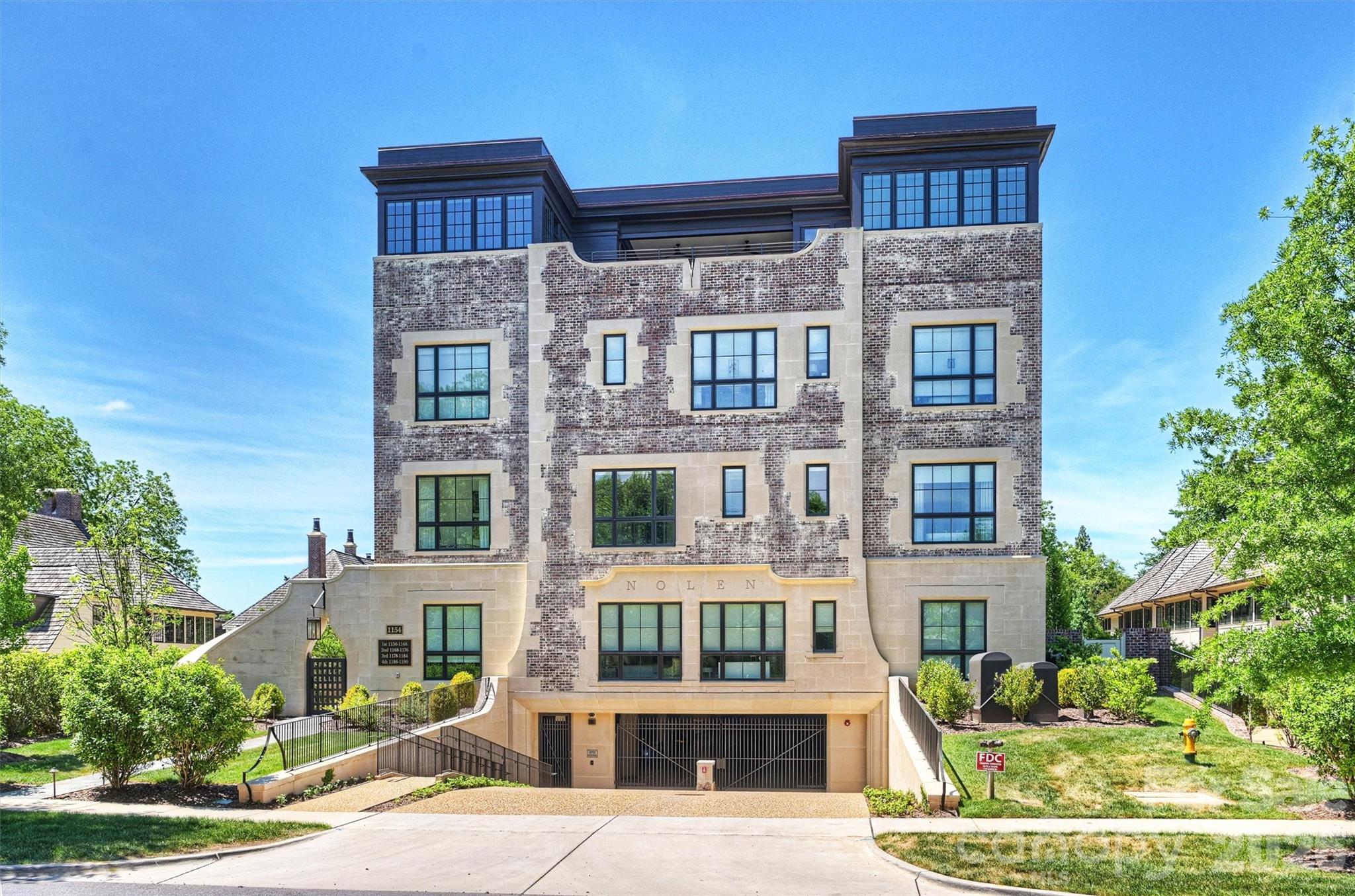 The Nolen on Queens Road presents an exclusive offering of seventeen luxury residences in the
heart of Myers Park. Designed by Ken Pursley and developed by Brian Speas, the building
reflects an exceptional commitment to timeless architecture, meticulous craftsmanship, and
thoughtfully integrated modern details. This nearly 2,400 square foot residence features an open,
light filled floor plan enhanced by ten foot ceilings and eight foot interior doors. The gourmet
kitchen is appointed with custom cabinetry, marble countertops, a Wolf range, and a paneled
SubZero refrigerator. The primary suite serves as a private retreat, offering an expansive closet,
direct terrace access, and a spa inspired bath with dual vanities, a soaking tub, and a
glass enclosed shower. Spacious covered terrace with bluestone pavers and builtin gas grill
extend the living space outdoors. Secure building entry, two designated parking spaces, a
climate controlled storage unit, and elegantly designed common areas complete this rare
opportunity along Queens Road.