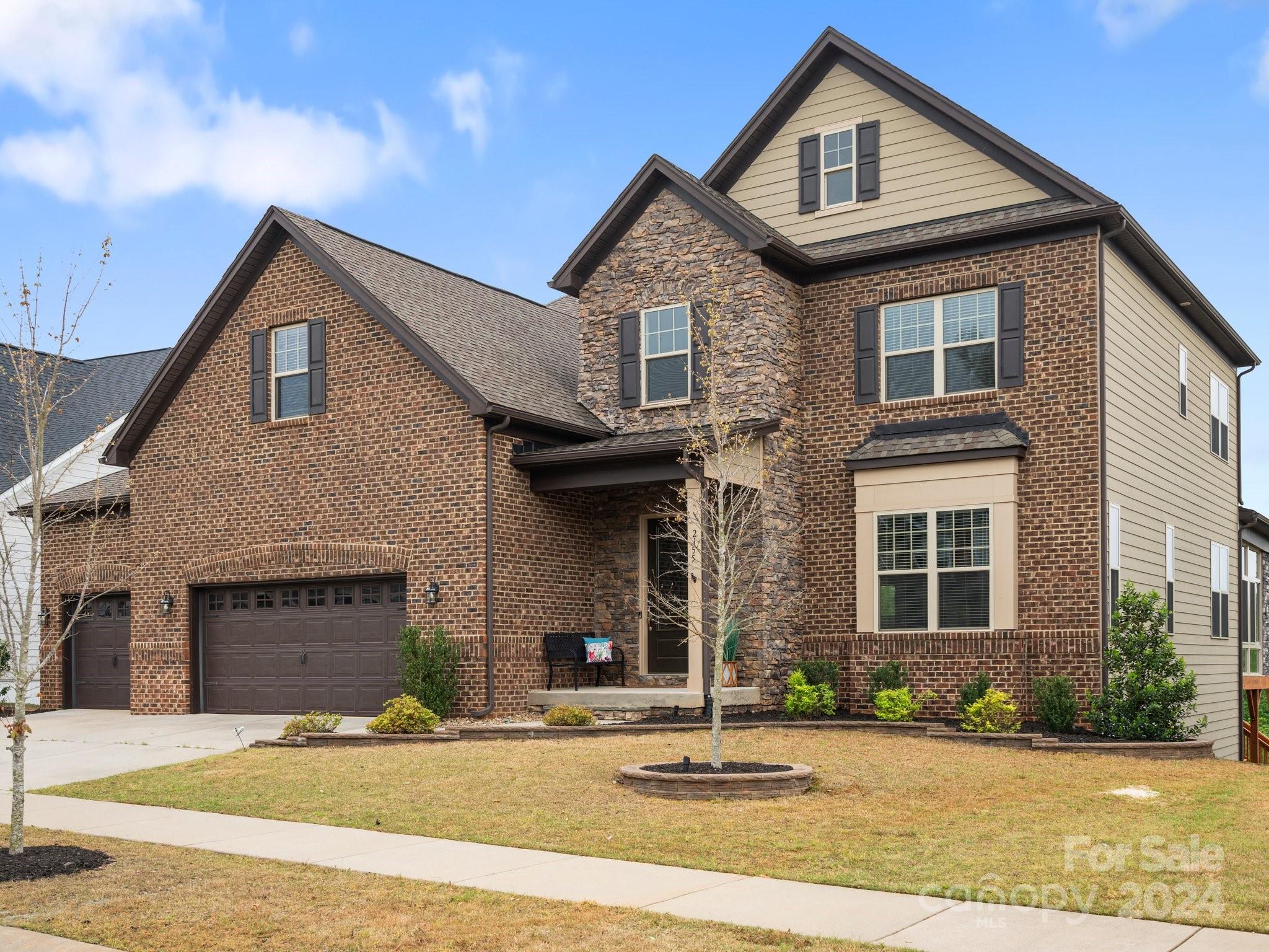 Step into luxury living in this stunning two-story foyer home located in the prestigious Waterside at the Catawba community. With 6 bedrooms and 5.5 bathrooms, this residence offers ample space and exquisite features for the modern family. The main level boasts a formal dining room complete with a mini bar, perfect for entertaining guests. The gourmet kitchen is a chef’s delight, featuring a double oven, gas cooktop, and expansive T island, all overlooking the open floor plan leading to the great room. Enjoy the convenience of a three-season room on the main level, ideal for year-round relaxation, along with a guest suite and private office for added versatility.
Upstairs, discover three spacious bedrooms, a loft, and a bonus room, providing ample space for family members or guests to enjoy. The fully finished basement is an entertainer’s paradise, featuring a bar area, additional bedroom and full bathroom, perfect for hosting gatherings or accommodating overnight guests in style.