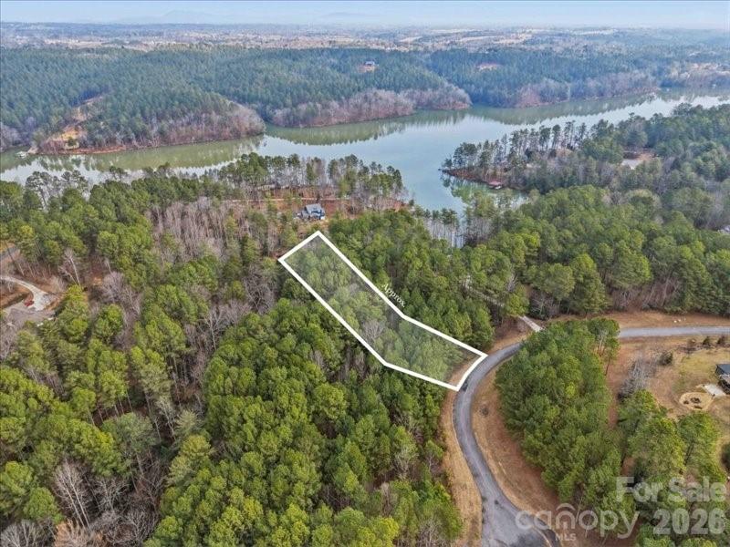 Nestled within the prestigious gated community of Harbor Ridge, this exceptional 1.28-acre 
lakefront lot offers a rare blend of natural beauty, privacy, and effortless access to lake 
living. The property’s gentle, tiered slope provides an ideal setting for a custom home, 
perfectly suited for a walk-out basement or thoughtfully designed multi-level outdoor 
spaces that capture serene water views. 
Surrounded by mature trees, the lot creates a peaceful, secluded retreat while still enjoying 
the benefits of a welcoming community with exclusive amenities. Residents have access to 
private lake entry, community boat slips, and dedicated boat and RV storage — perfect for 
those who embrace an active, outdoor lifestyle. 
Whether you envision building a full-time residence or a relaxing weekend escape, 108 
Rivercliff Drive West offers the space, setting, and lifestyle you’ve been dreaming of. 
Discover the very best of lakefront living in Harbor Ridge.