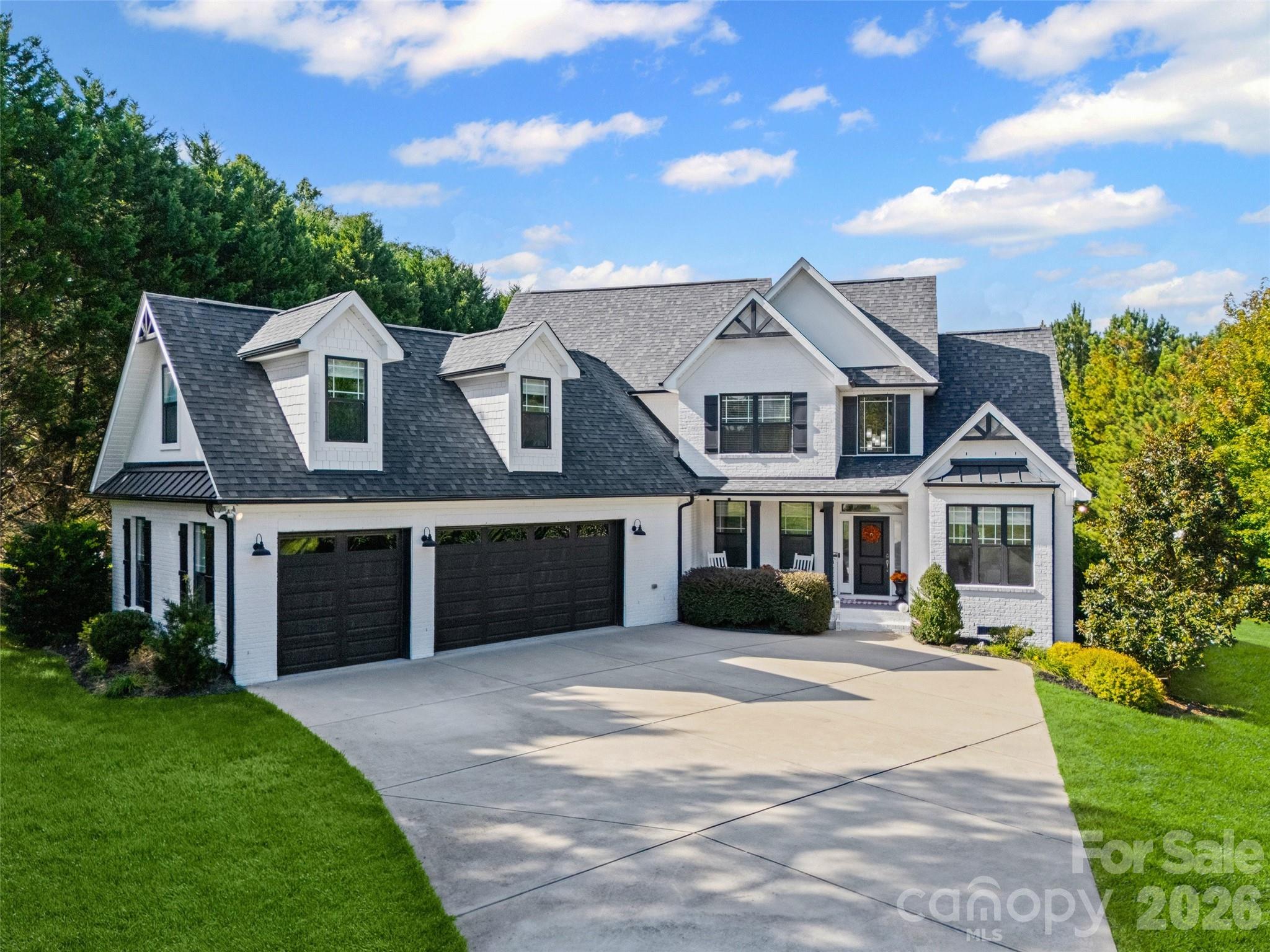 Welcome to 3204 Millstone Creek Road! Nestled on a 1.4 acre lot, is the perfect blend of modern luxury with the serenity of nature. Enjoy the mass of mature evergreens, sunsets over the pond, smores around the fire, or a dip in the pool. Grab your fishing rod, paddleboat or kayak, and experience both the fun and tranquility of nature, right in your own backyard!  Open-concept design with a large island, perfect for entertaining. Primary suite showcases tray ceilings, and a freestanding tub on main level. Additional bedroom on main level, designed with flexibility in mind, equipped with a murphy bed, can be used as an office, bedroom or more. Laundry room on main level. Bonus room on upper level is currently used as a theater and game room, but the large retreat is a great space to let your creativity flow.  Bursting with amenities, this is more than a home, it’s a lifestyle. Beautiful landscapes, fenced Pet Courtyard, Saltwater Pool, Firepit, Outdoor kitchen, 3 Car Garage with epoxy floors, the list goes on! Location is ideal, while nestled in its own sanctuary, this home is just minutes away from grocery stores, retail shopping, schools and more. Your personal paradise awaits!
