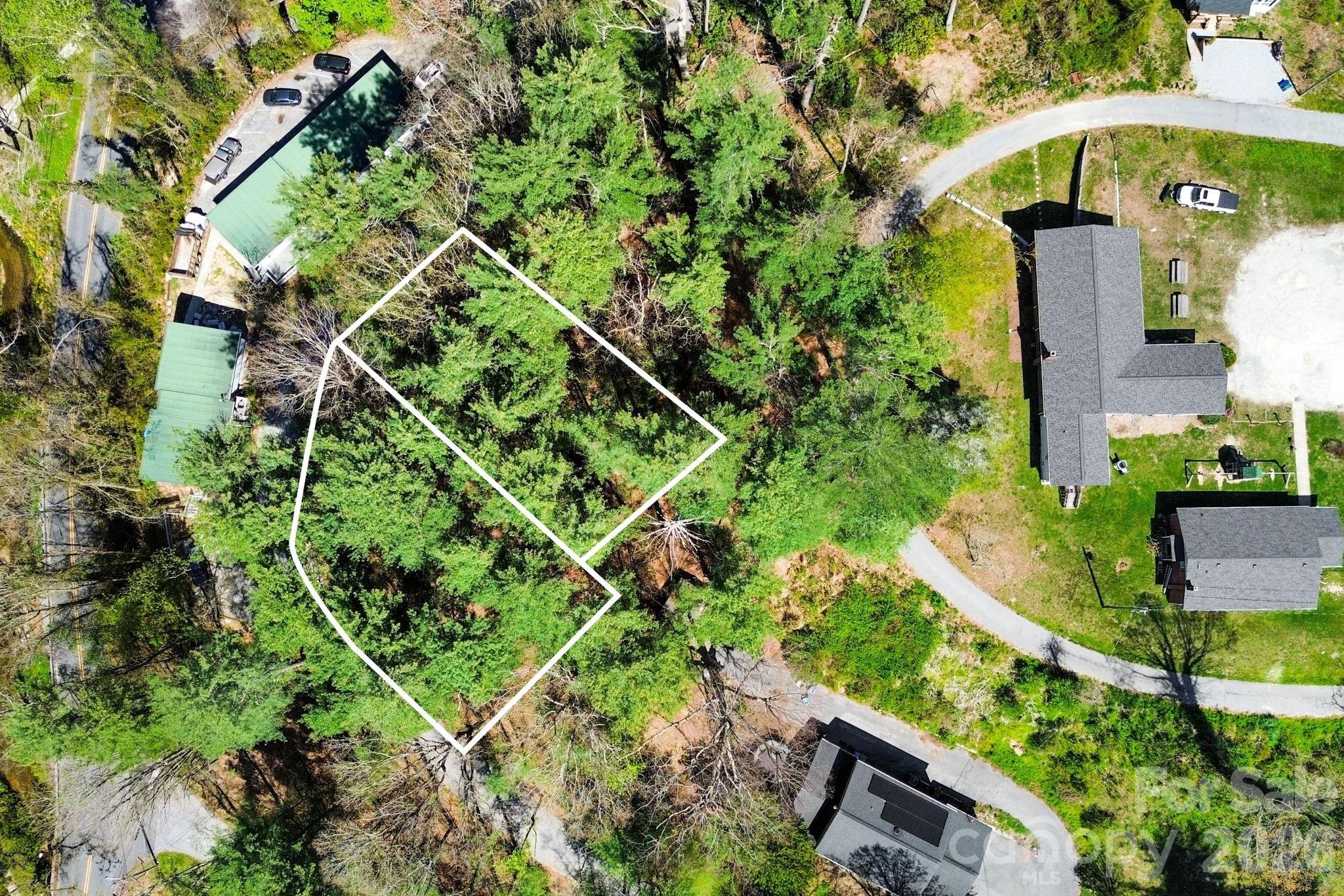 Lots 21 and 22 combine to offer 0.30 acres with southwest-facing views overlooking West Allen Street and Lilly Pond Road, extending to a long-range view of downtown Hendersonville. Minutes from one of the Ecusta Trail’s convenient access points at Willow Road and Kanuga Road, this homesite offers easy connectivity to miles of scenic walking and biking trails. Enjoy proximity to local favorites, including Dry Falls Brewing Company, Hot Dog World, Publix and Fresh Market. City water and sewer are available with applicable tap and connection fees.