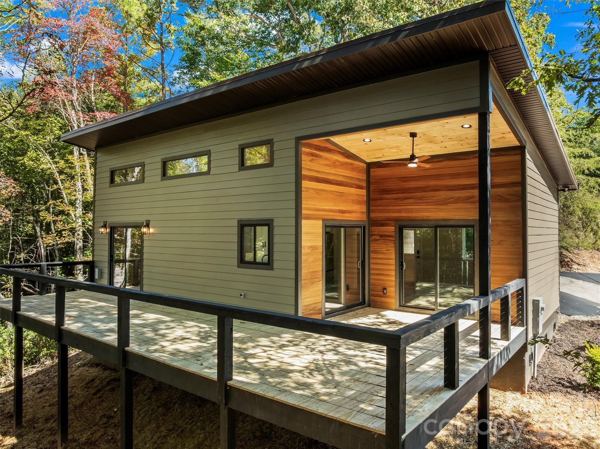 PRICED TO SELL! Perfect mountain retreat, 5 minutes from downtown Bryson City!  Nestled in a peaceful, wooded setting, this stunning 2-bedroom, 2-bath home blends luxury and mountain charm.  The open floor plan creates a bright, inviting flow from the high-end kitchen, complete with Kohler fixtures, granite countertops, and premium appliances, to the spacious living area that captures the beauty of the outdoors without ever leaving your living room.  The glamorous master bath offers a spa-like escape, combining elegant finishes with everyday comfort.  Step outside to nearly 500 sq. ft. of outdoor living space, perfect for entertaining, relaxing, or soaking in the fresh mountain air.  Located in Vista Reserve, a highly desirable boutique subdivision with paved roads and ample parking, this home delivers the best of both worlds: modern luxury and serene mountain living.  Due to the foam insulation, quality construction, and energy-efficient appliances, the water and power bills for a winter month are less than $3.00 per day!